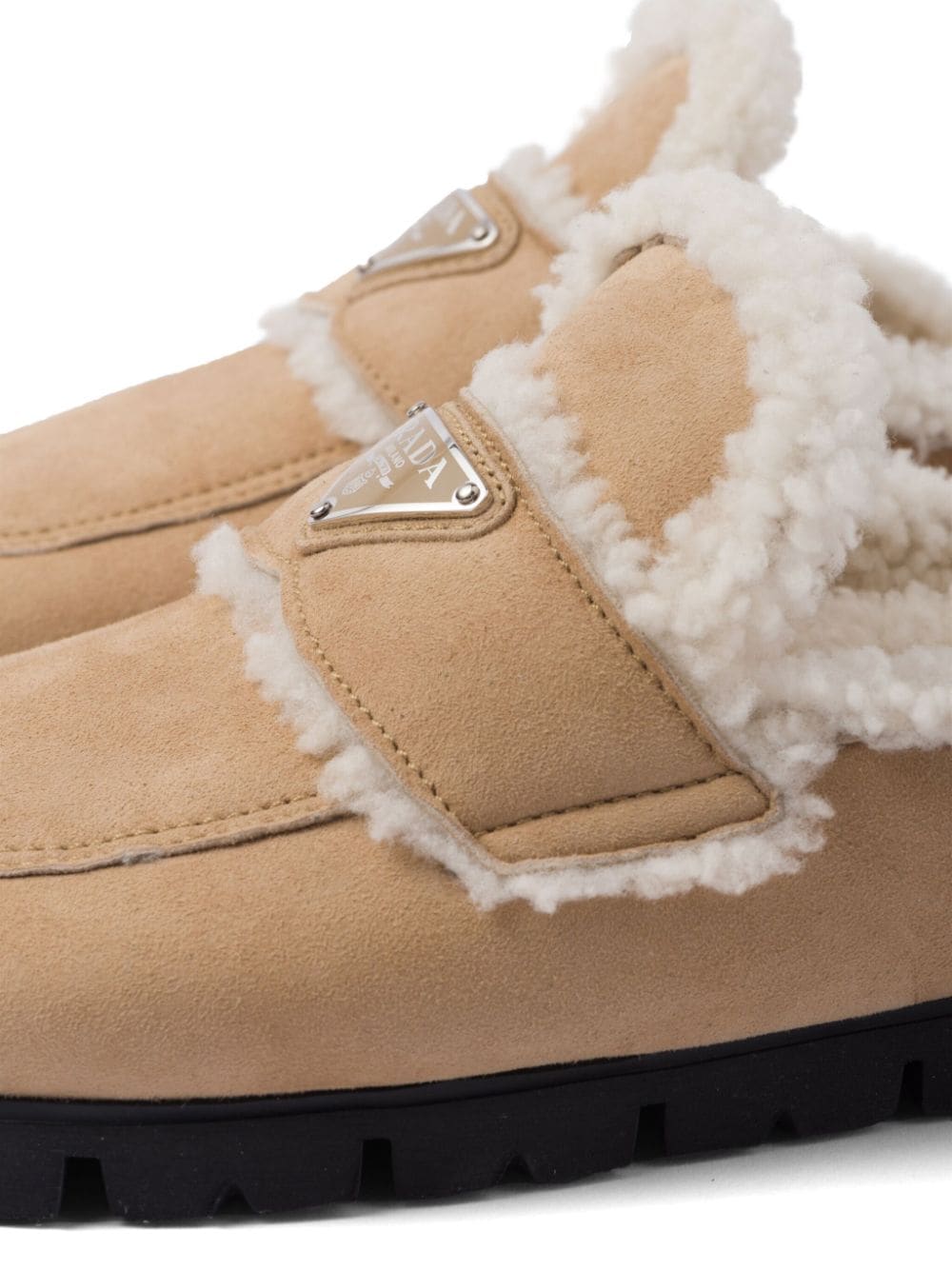Replica Pradas triangle-logo shearling slippers