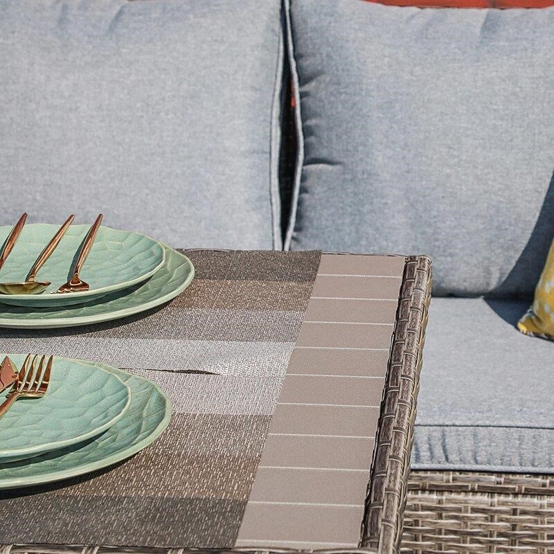 Binpal 7 Piece Rattan Sectional Seating Group with Cushions