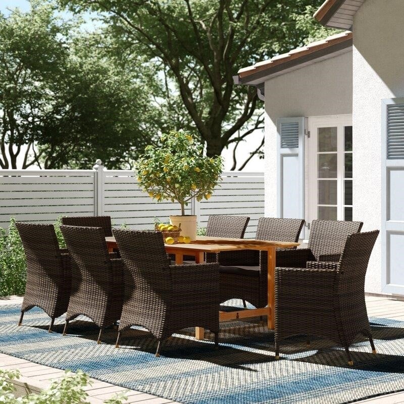 Decastro Rectangular 8 - Person 67'' Long Dining Set with Cushions