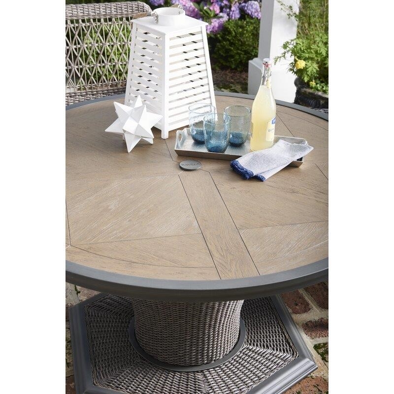 Lucus Round 4 - Person 54'' Long Dining Set with Cushions