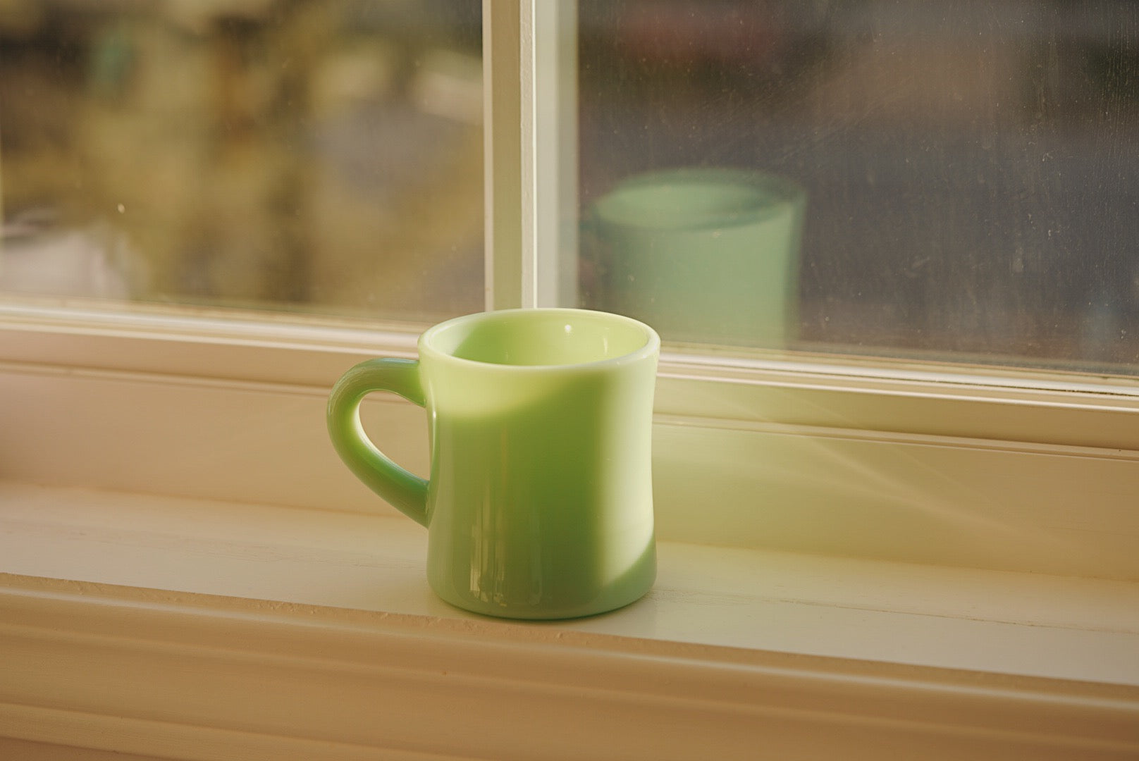 white And green milk glass mug
