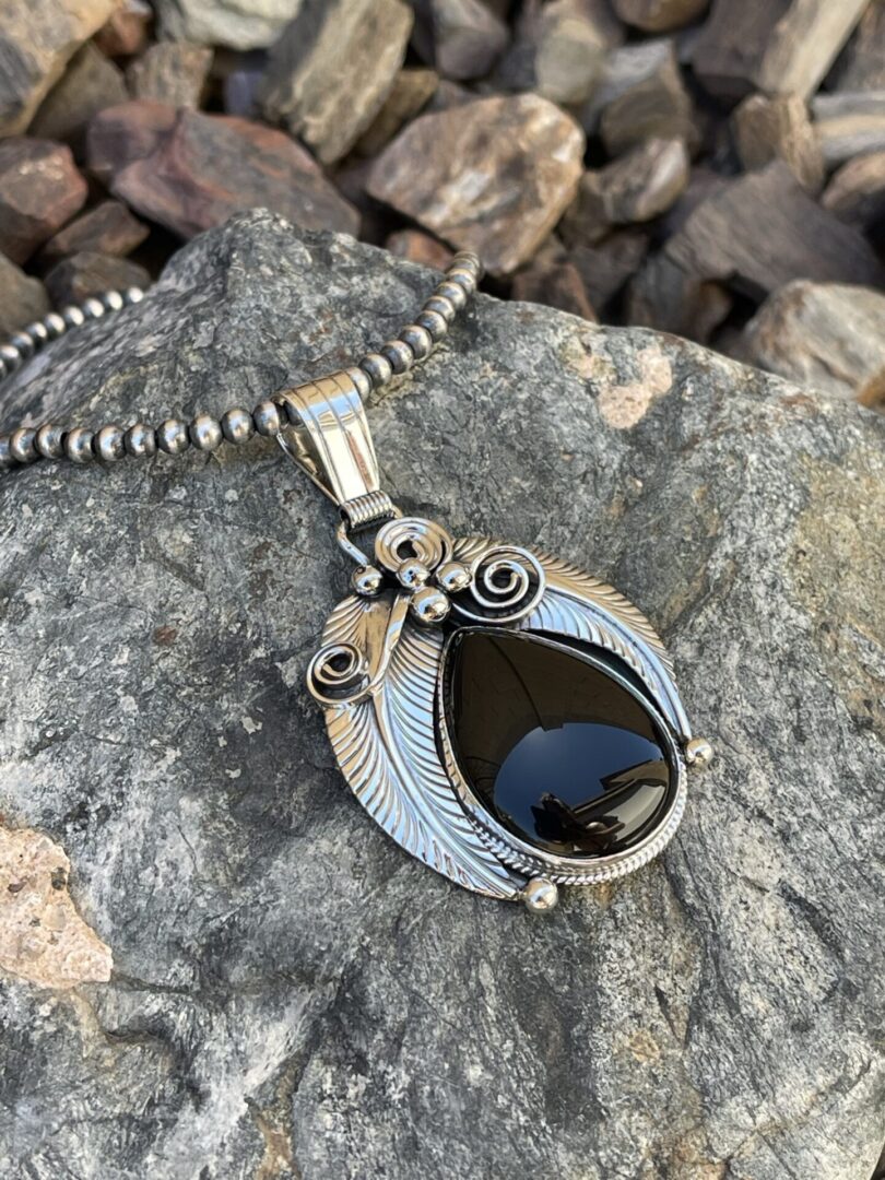 Sterling Silver Black Onyx Pendant with Feather, Scroll and Bead Detail