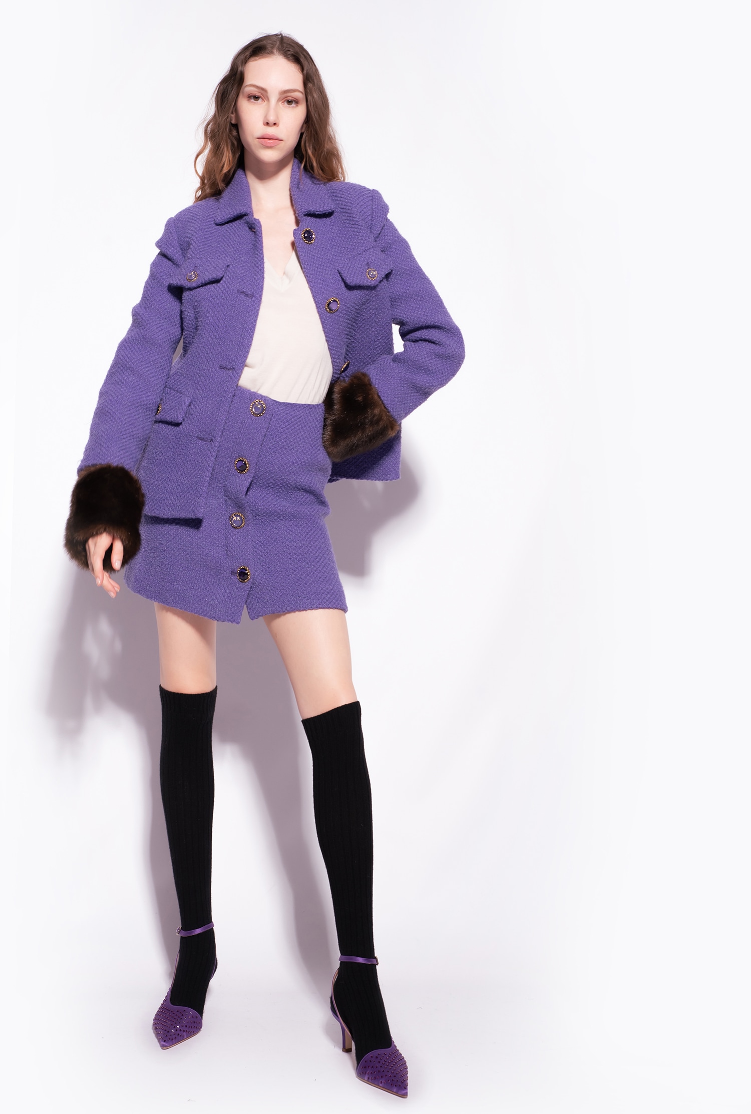 Buttoned bouclé mini skirt