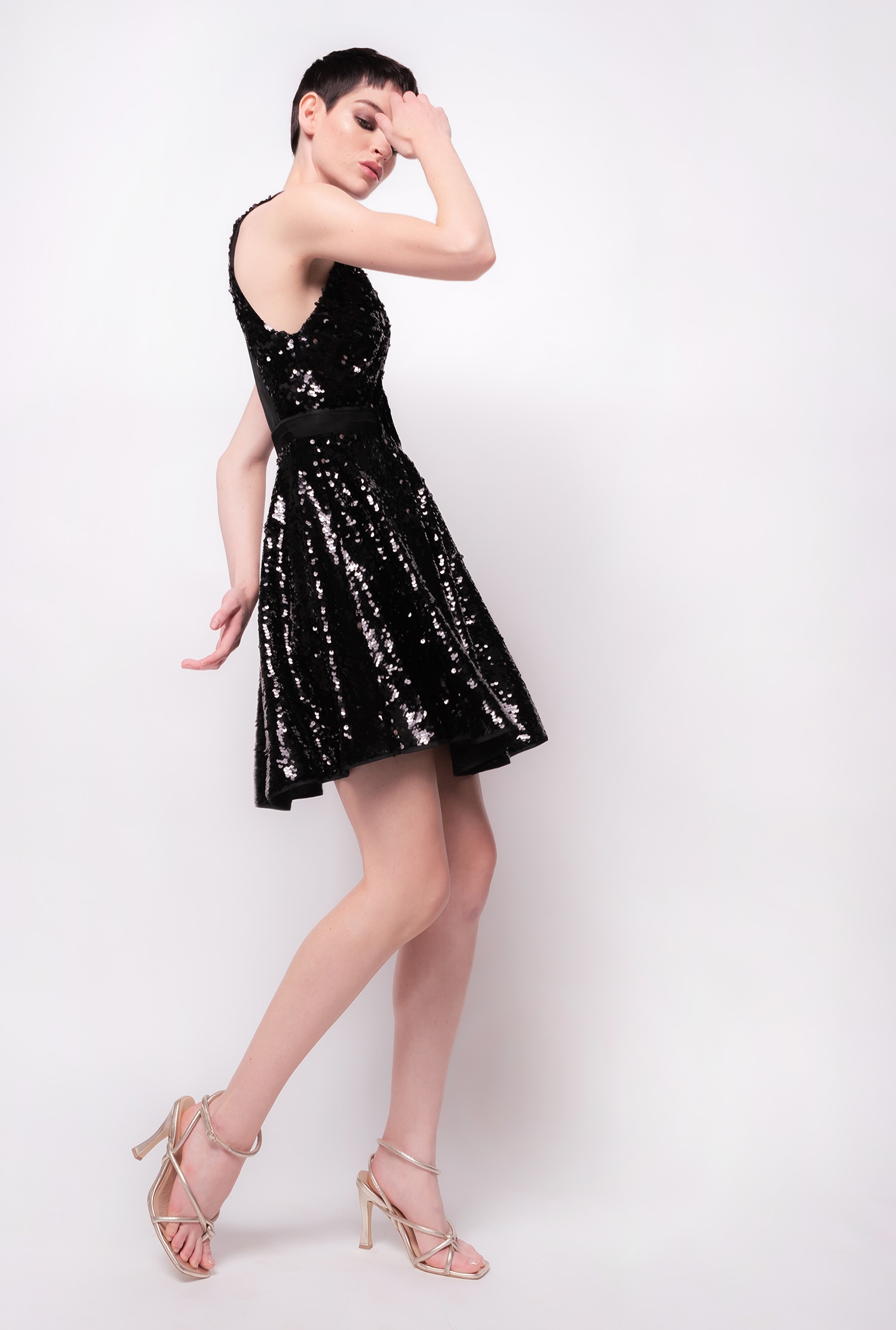 Fully sequinned mini dress with open back