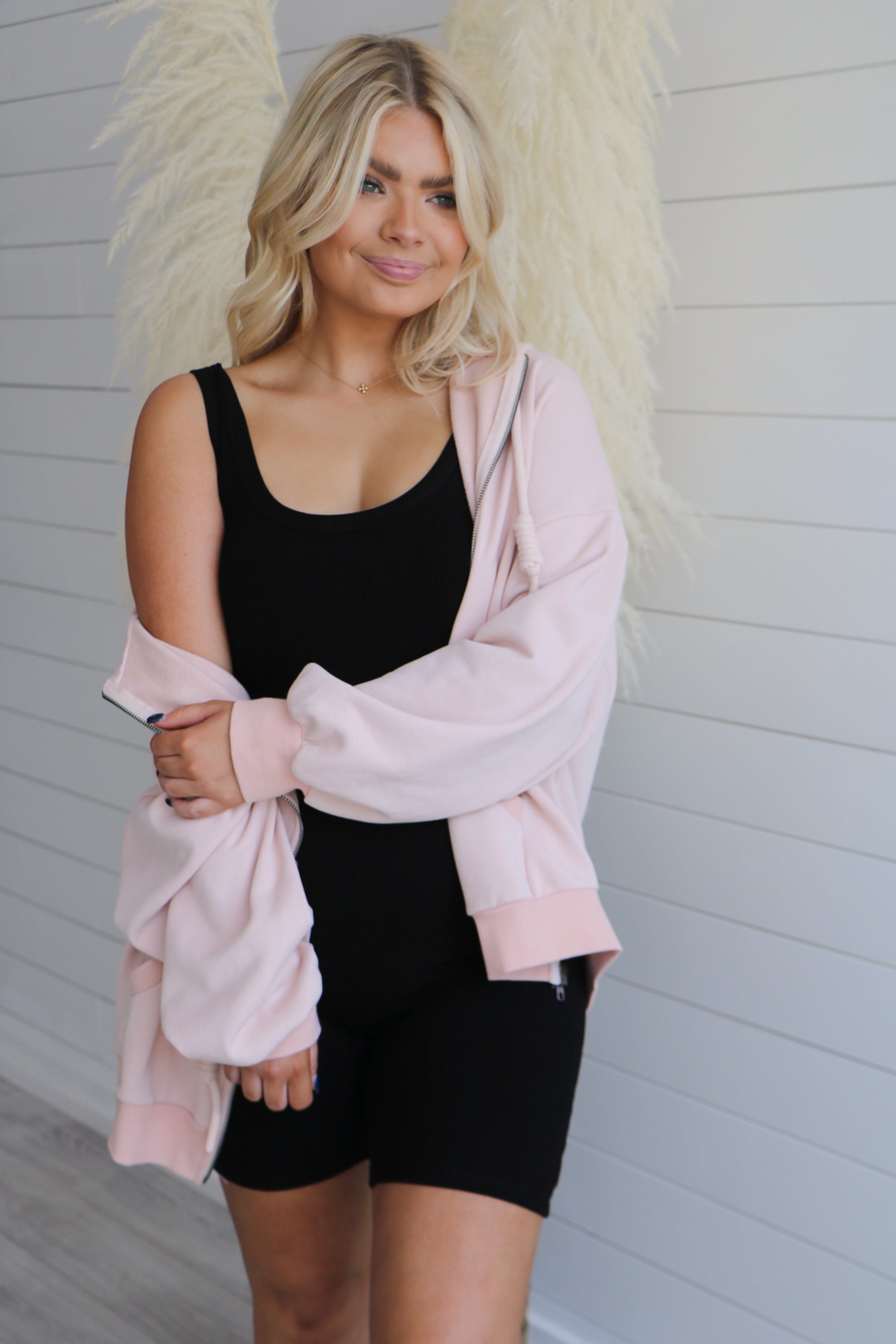 Taking Off Jacket in Blush