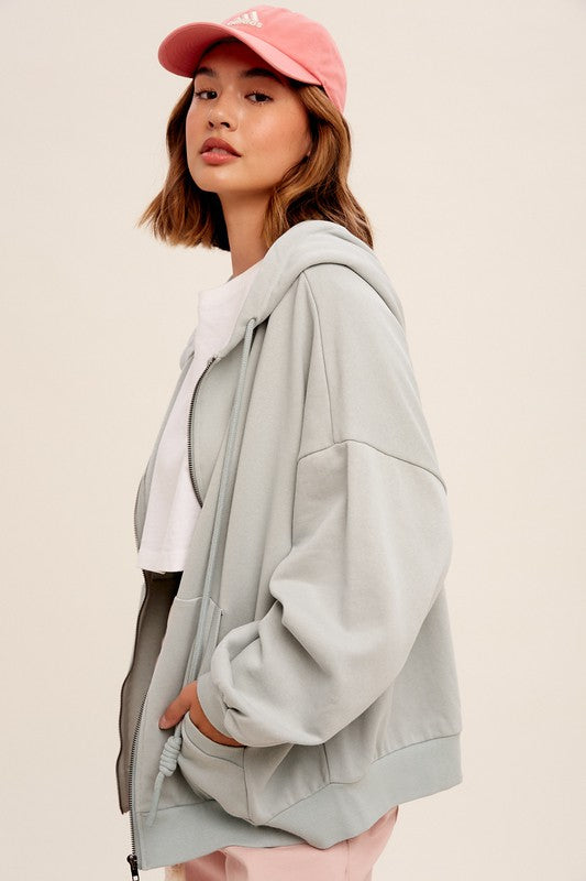 Taking Off Jacket in Sage