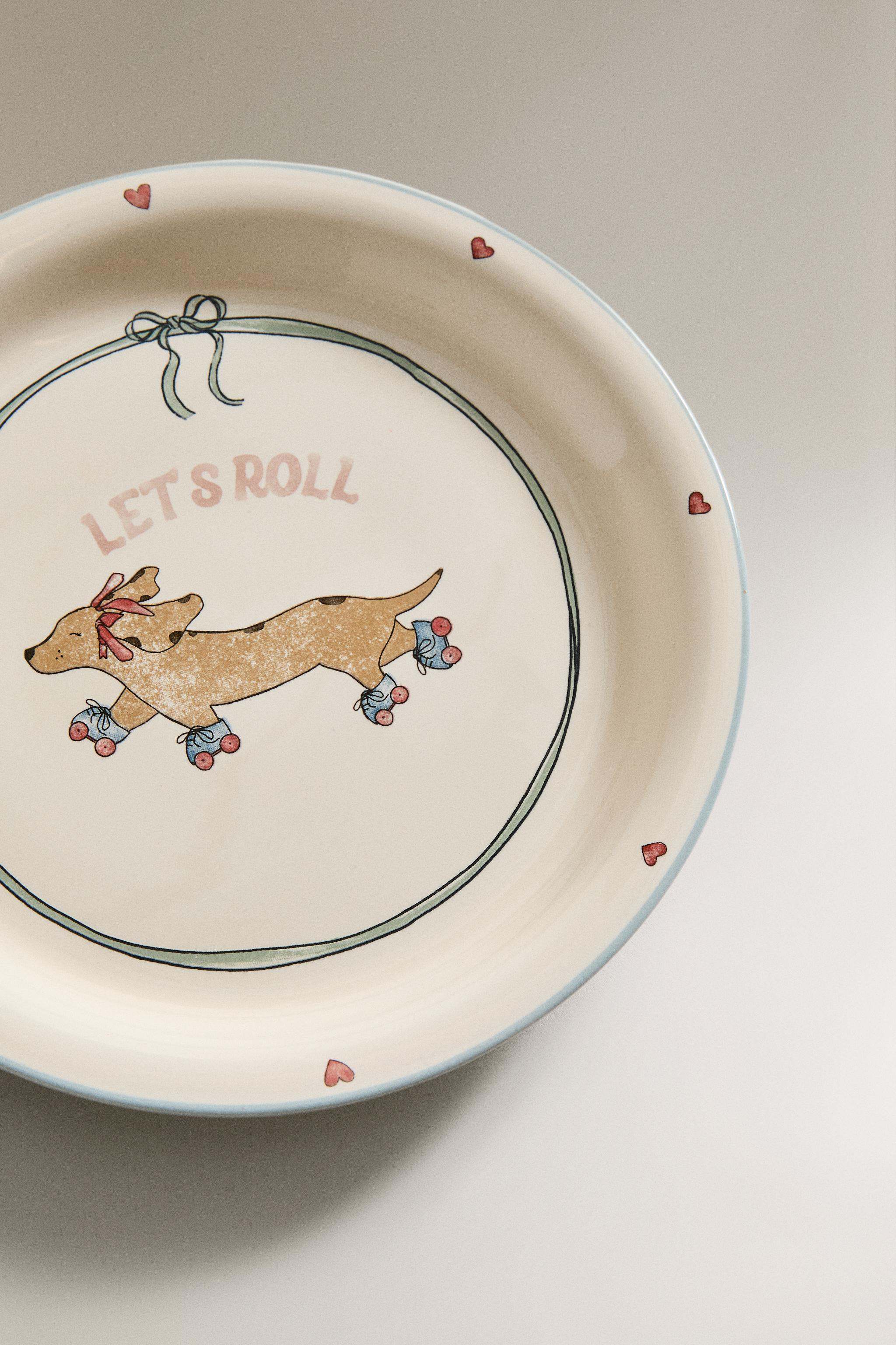 CHILDREN'S CERAMIC SKATING DOG PLATE