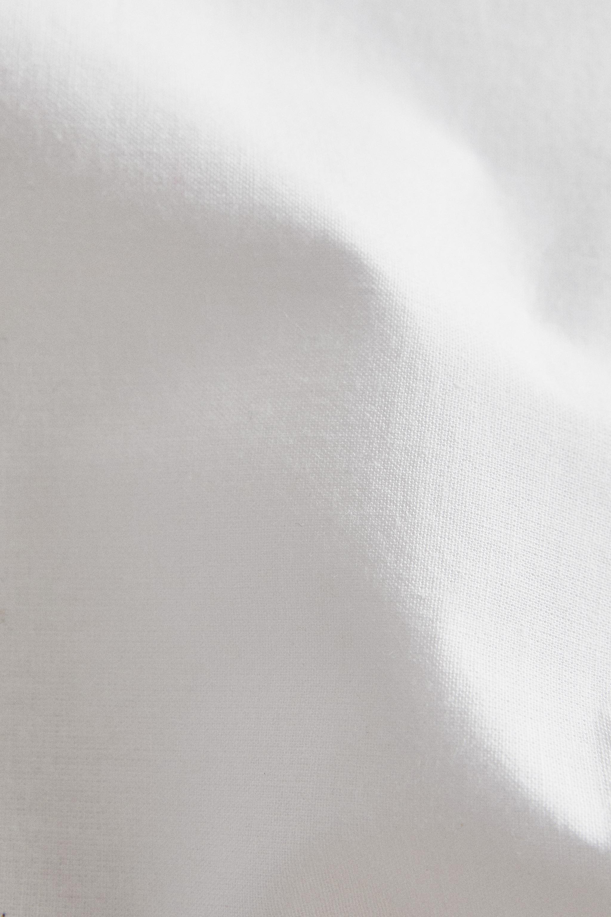 ROUND PLACEMAT WITH RUFFLE