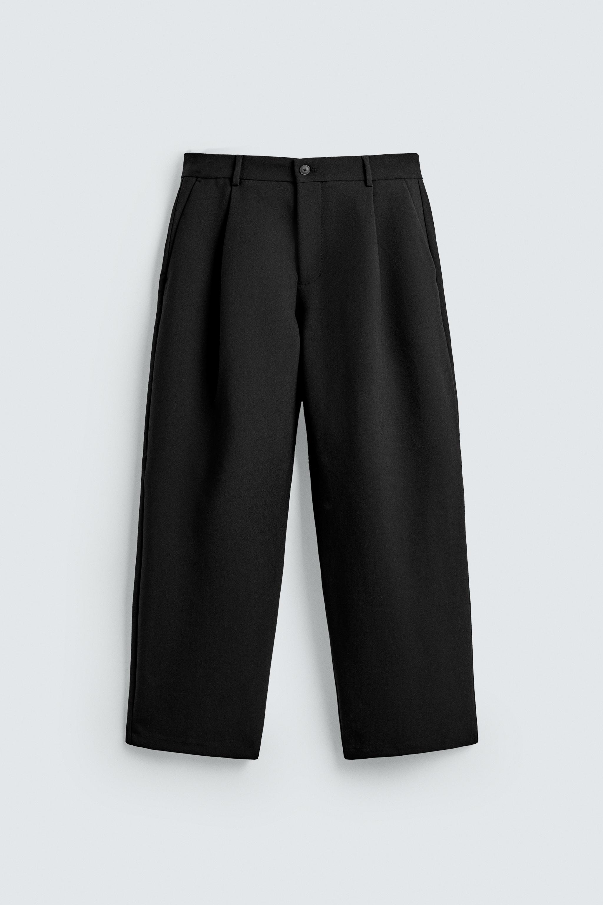 RELAXED FIT PLEATED PANTS