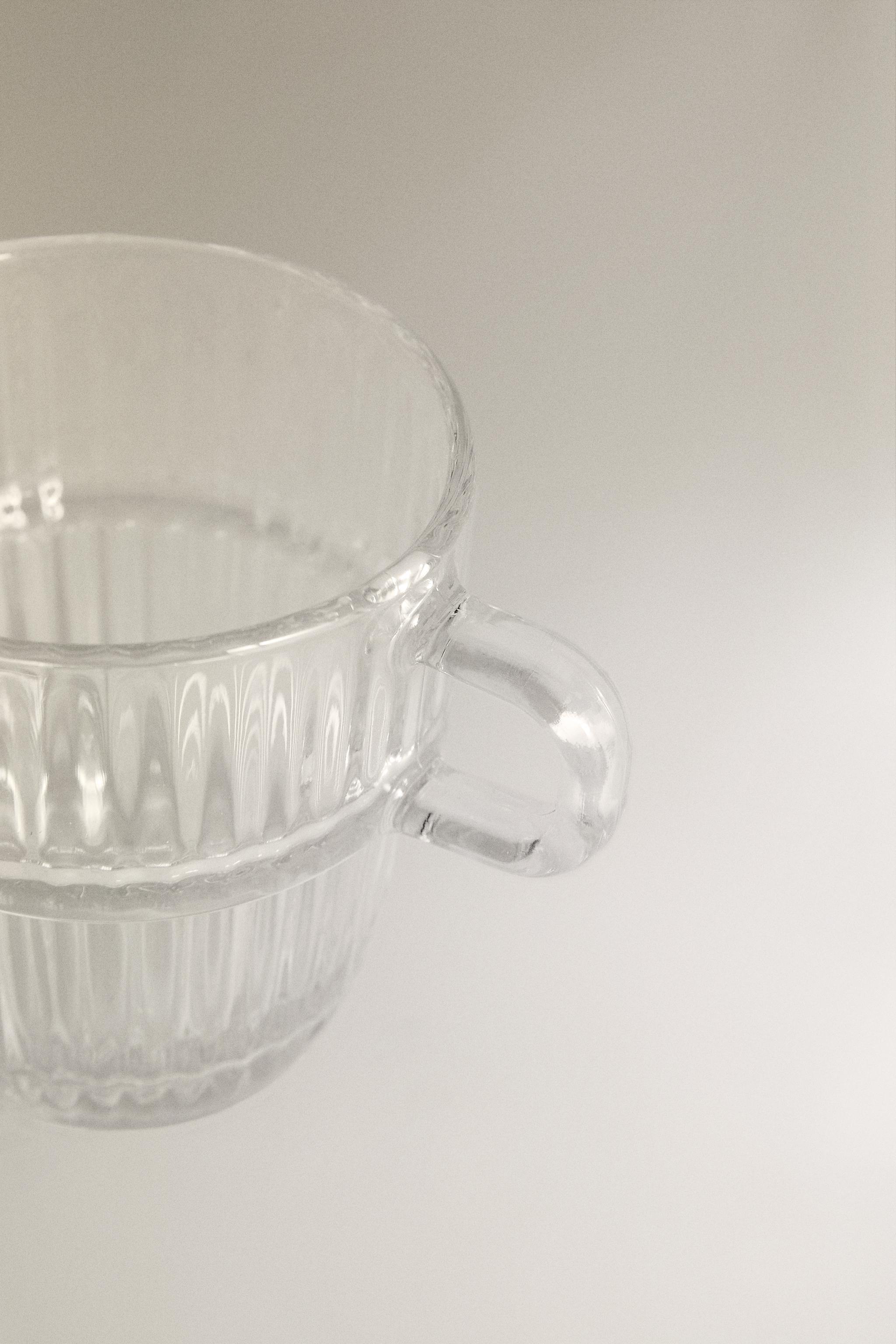 GLASS CUP WITH RAISED DESIGN