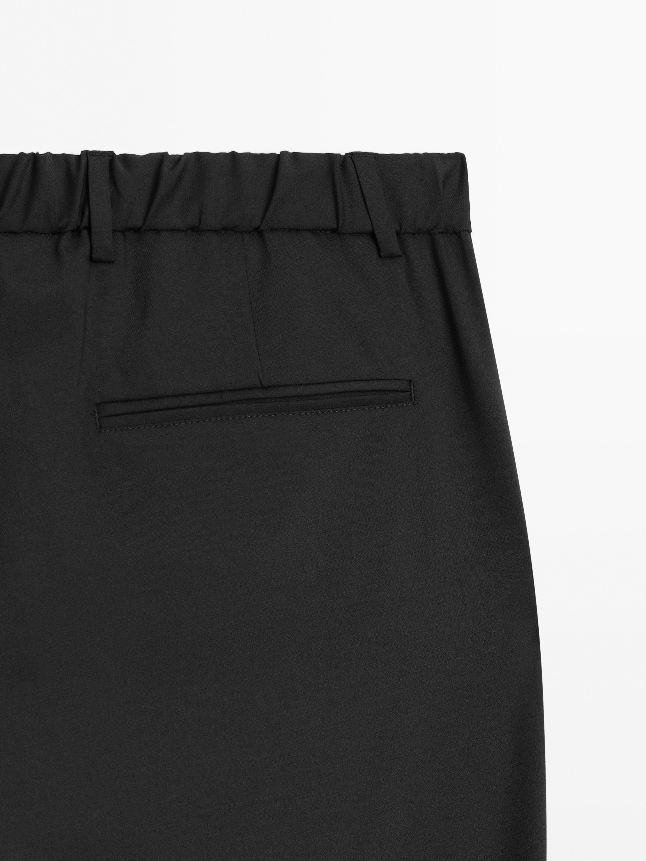 Relaxed fit trousers with darts