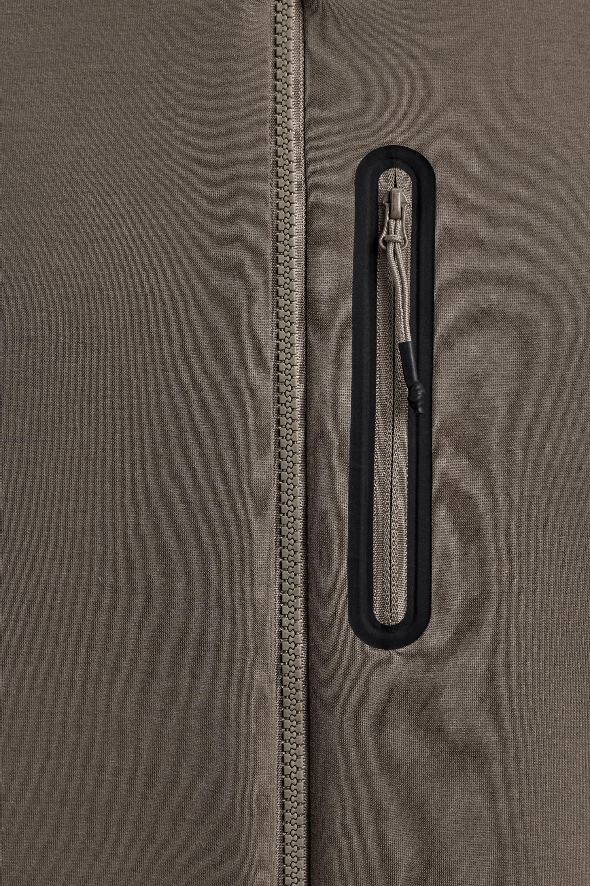 TECHNICAL ZIP-UP HOODIE