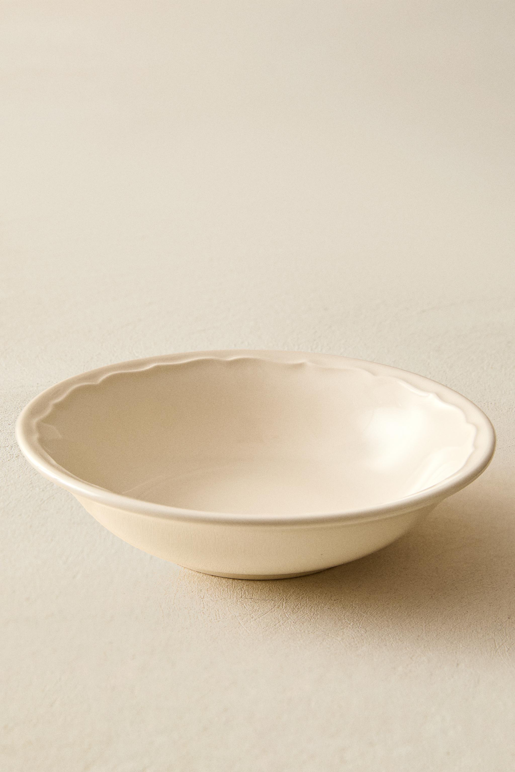 EARTHENWARE BOWL WITH RAISED-DESIGN EDGE