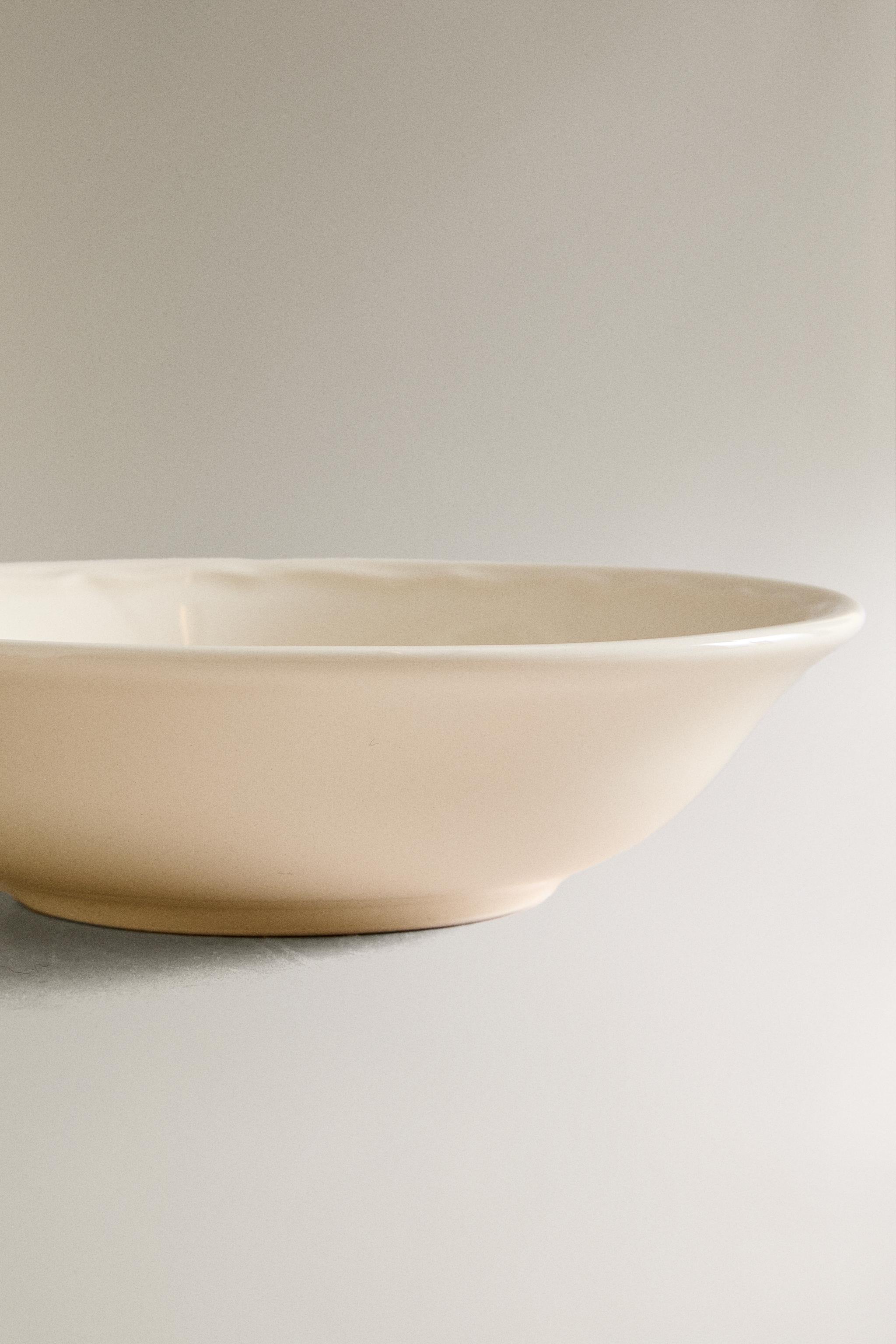 EARTHENWARE BOWL WITH RAISED-DESIGN EDGE