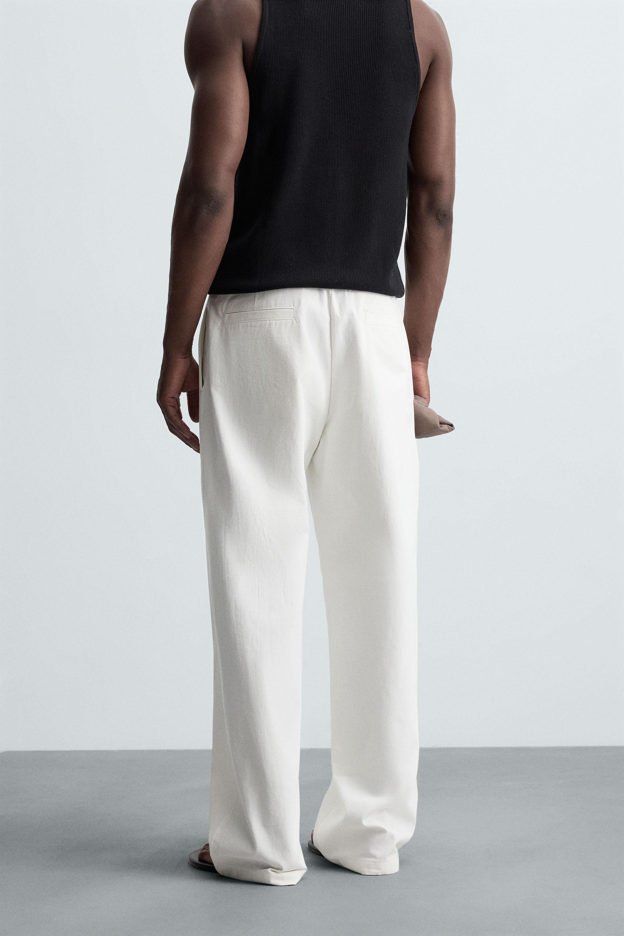 RELAXED FIT PLEATED PANTS