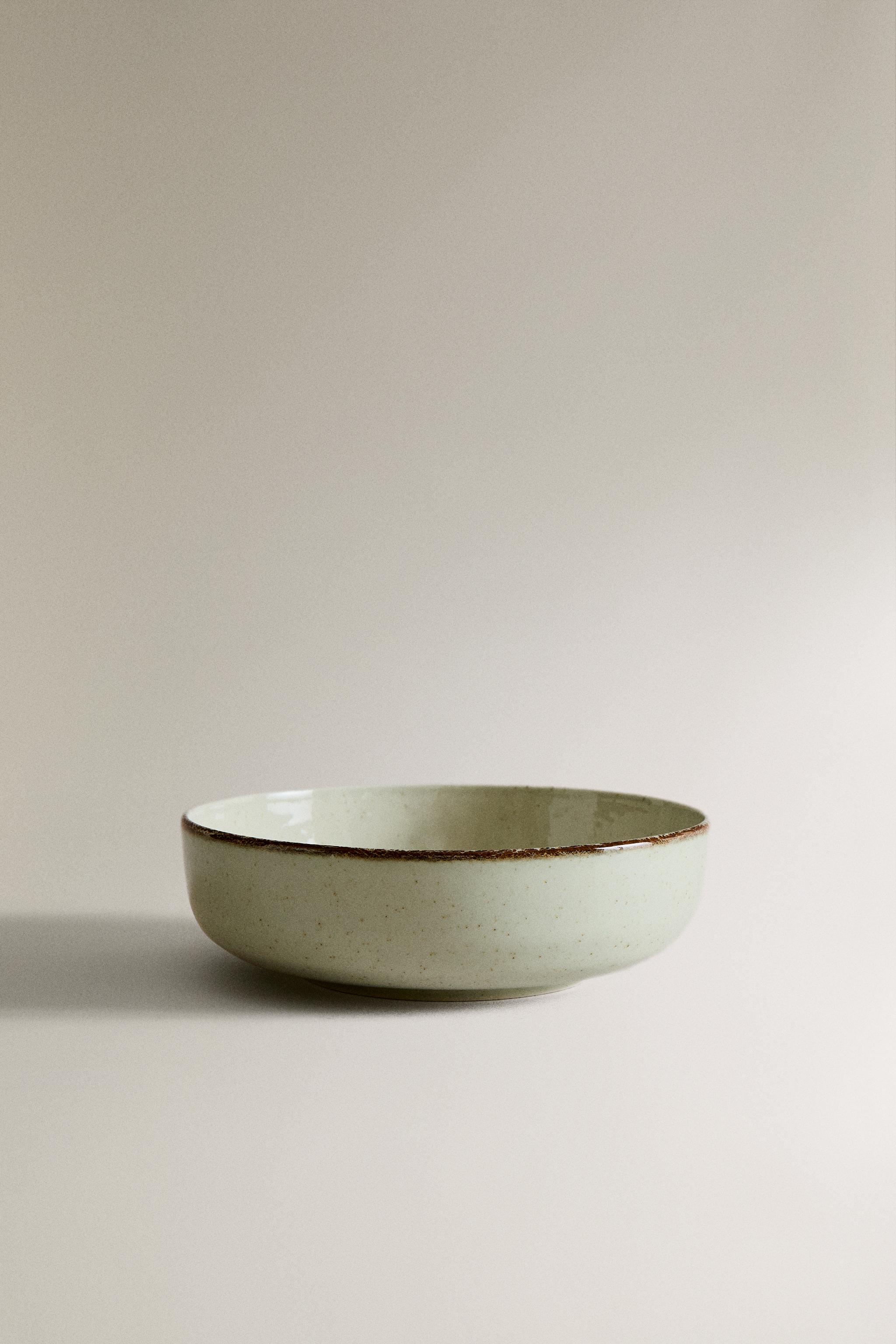PORCELAIN BOWL WITH ANTIQUE FINISH RIM