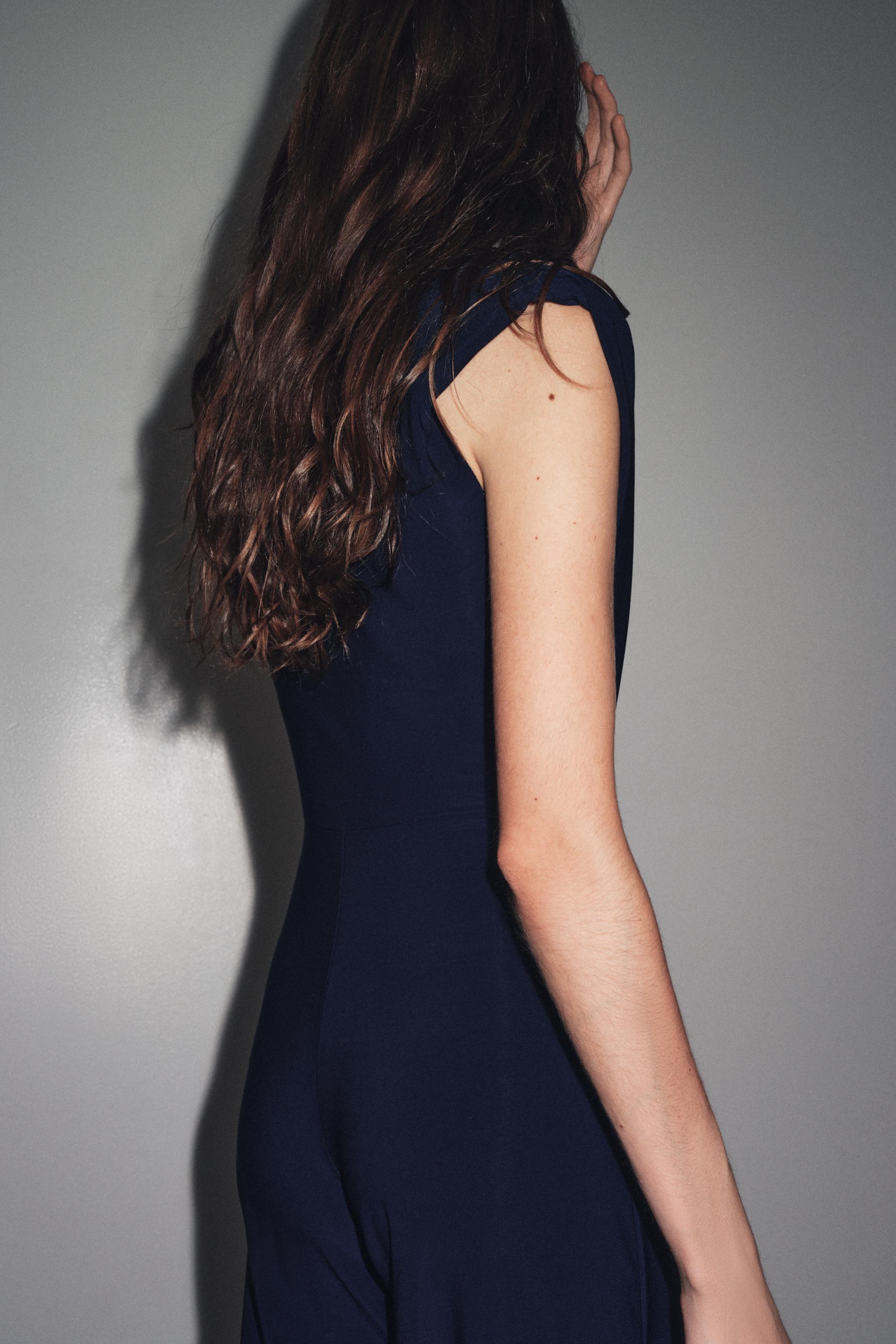 LONG DRAPED SHOULDER PAD JUMPSUIT