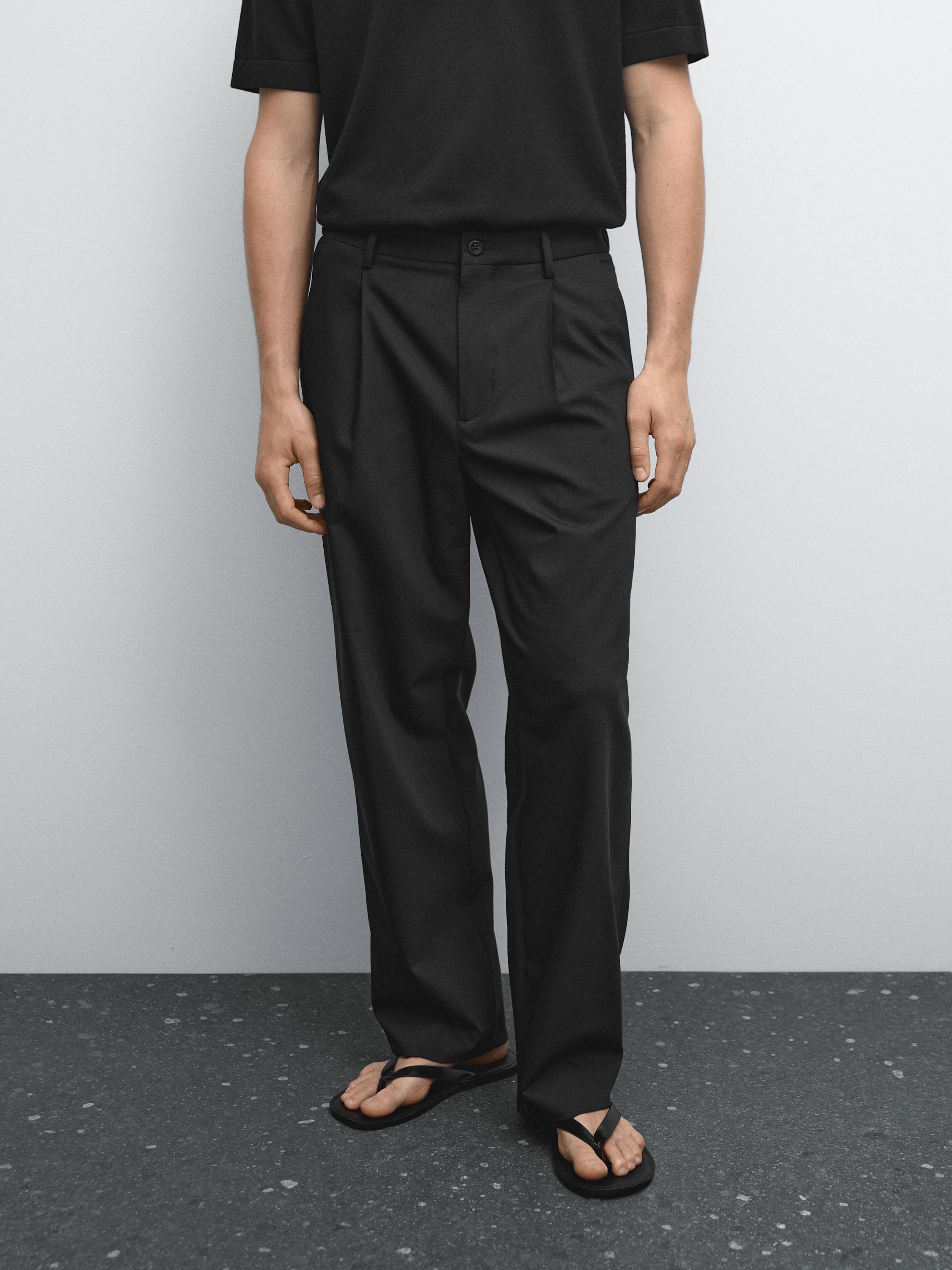 Relaxed fit trousers with darts