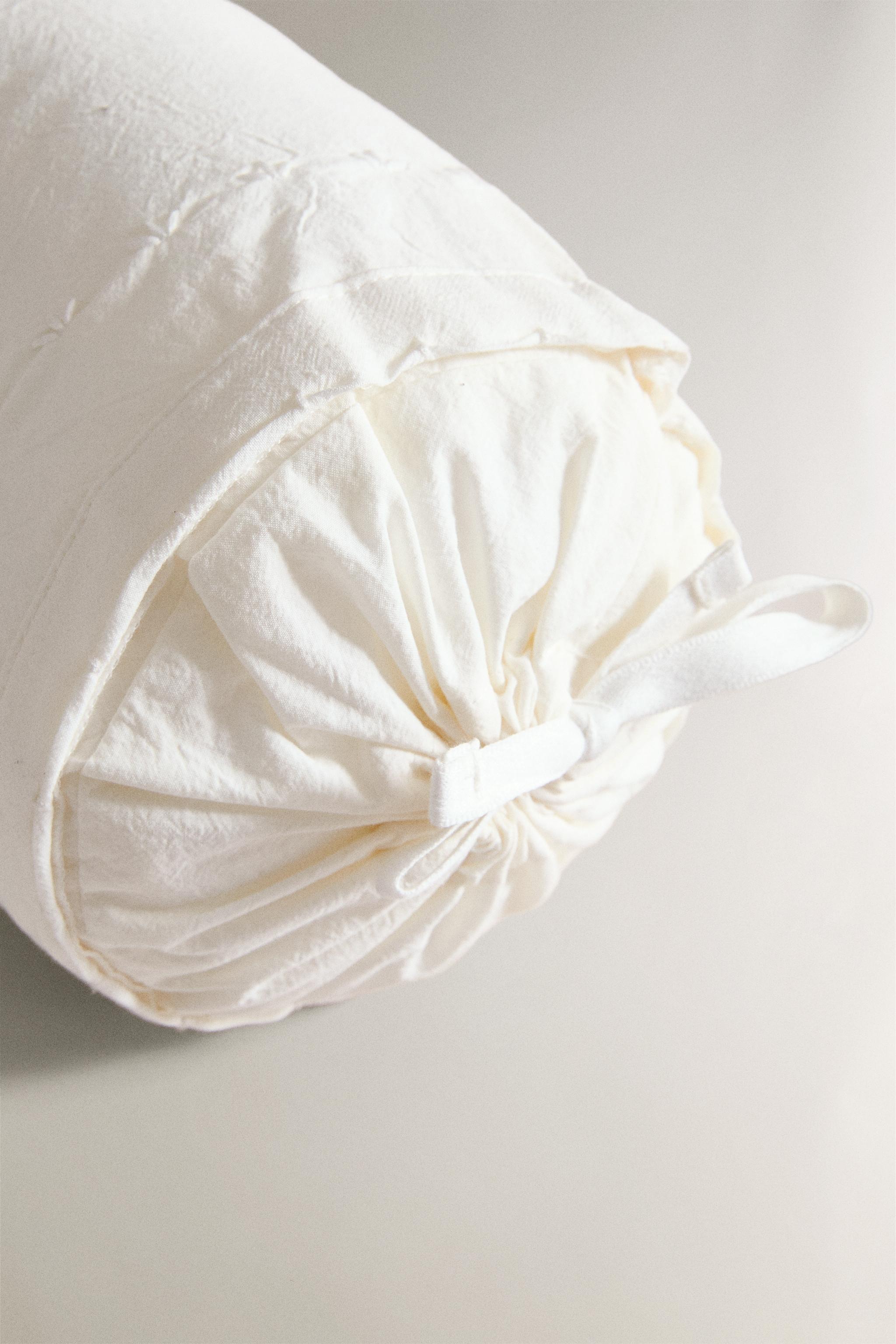 CHILDREN'S BOLSTER CUSHION WITH EMBROIDERED DESIGN