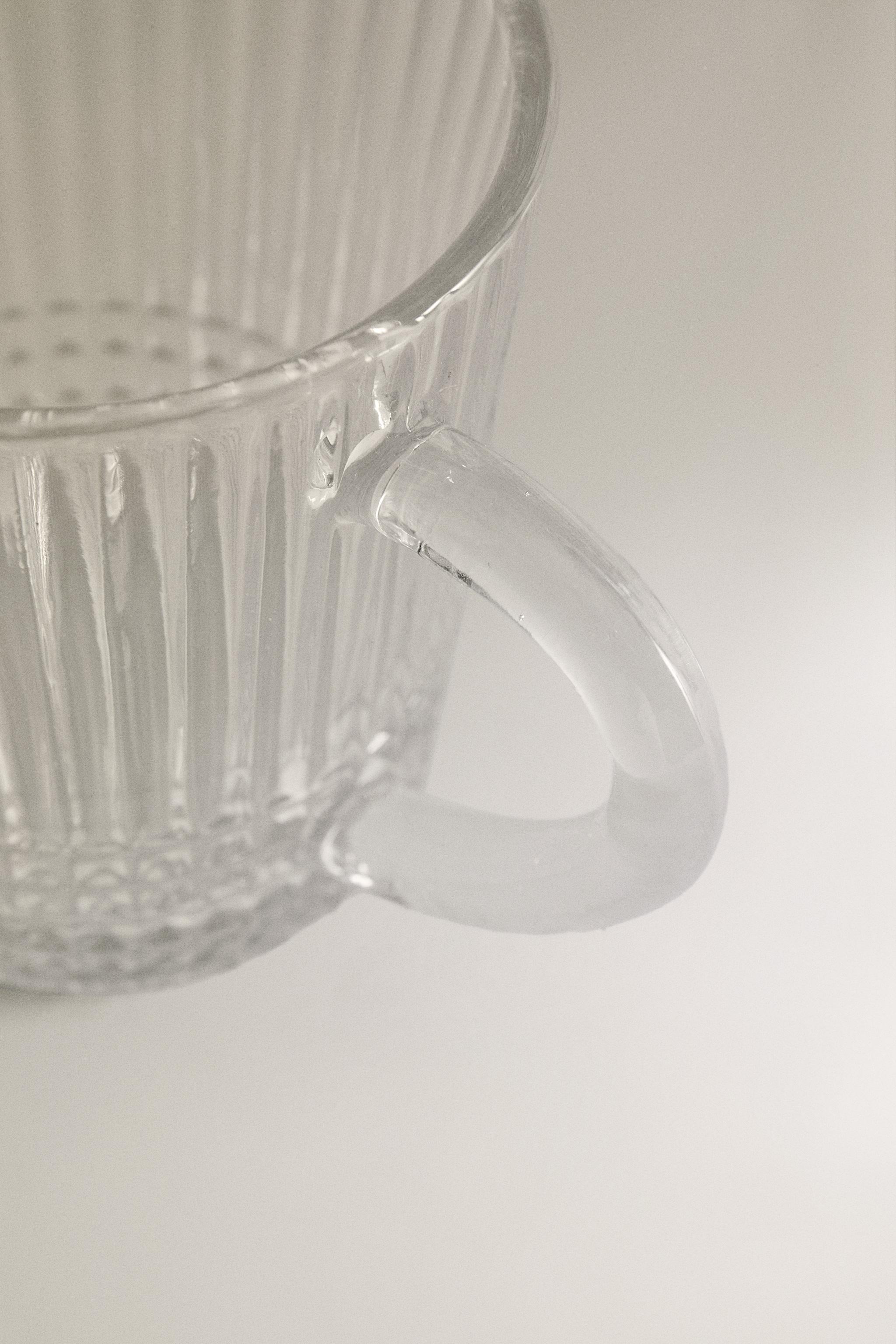 GLASS MUG WITH A RAISED GEOMETRIC DESIGN