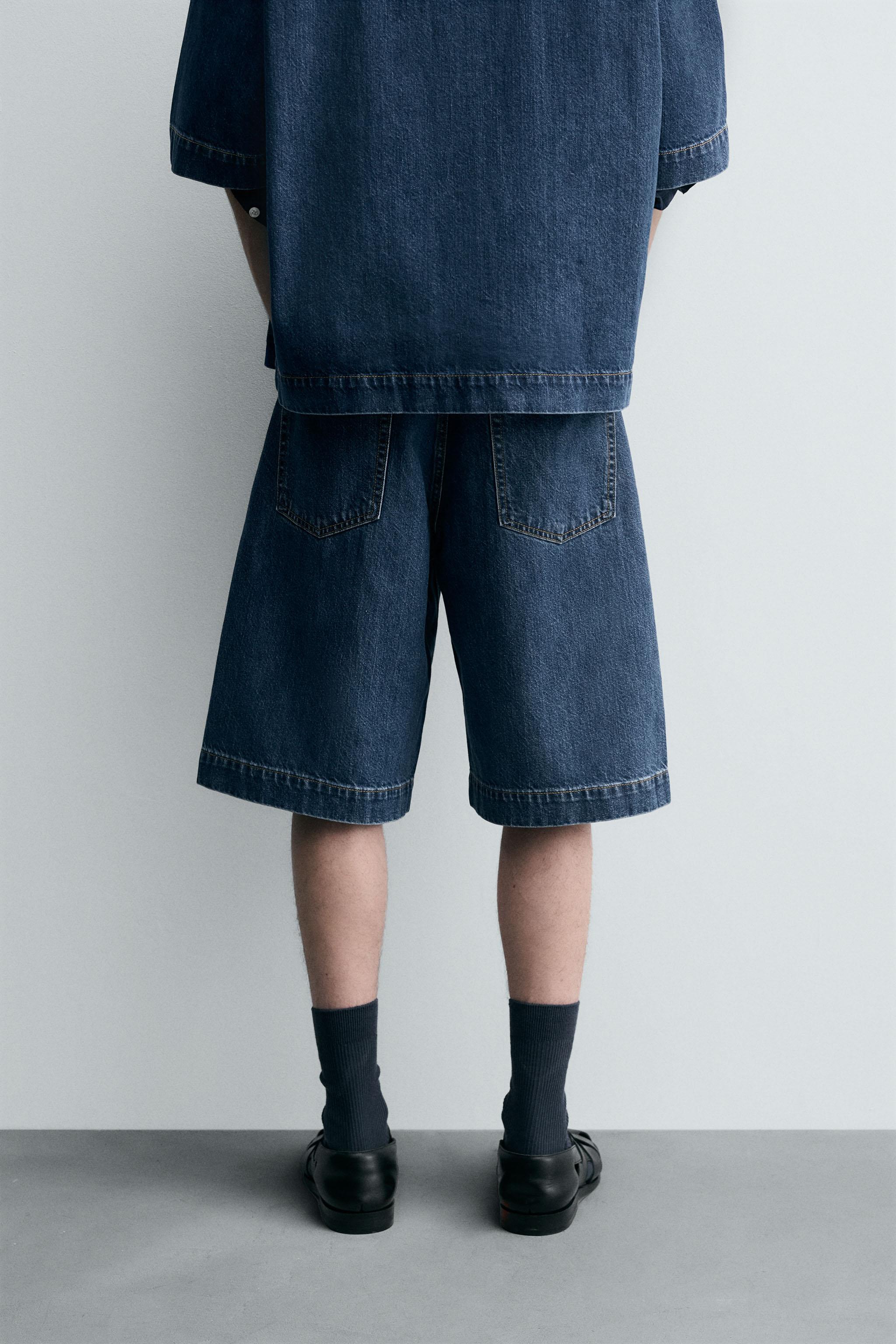 PLEATED RELAXED FIT DENIM SHORTS