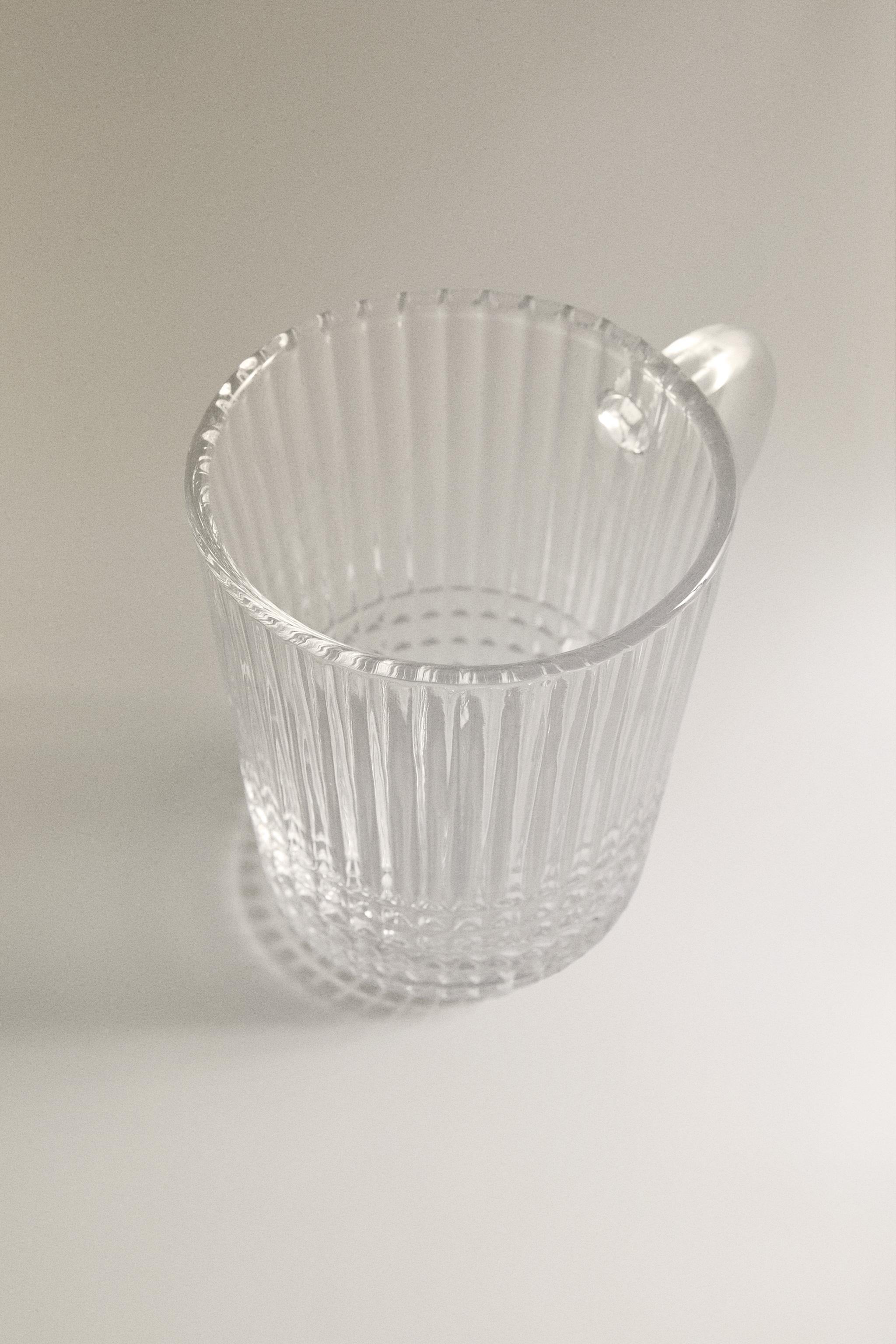 GLASS MUG WITH A RAISED GEOMETRIC DESIGN