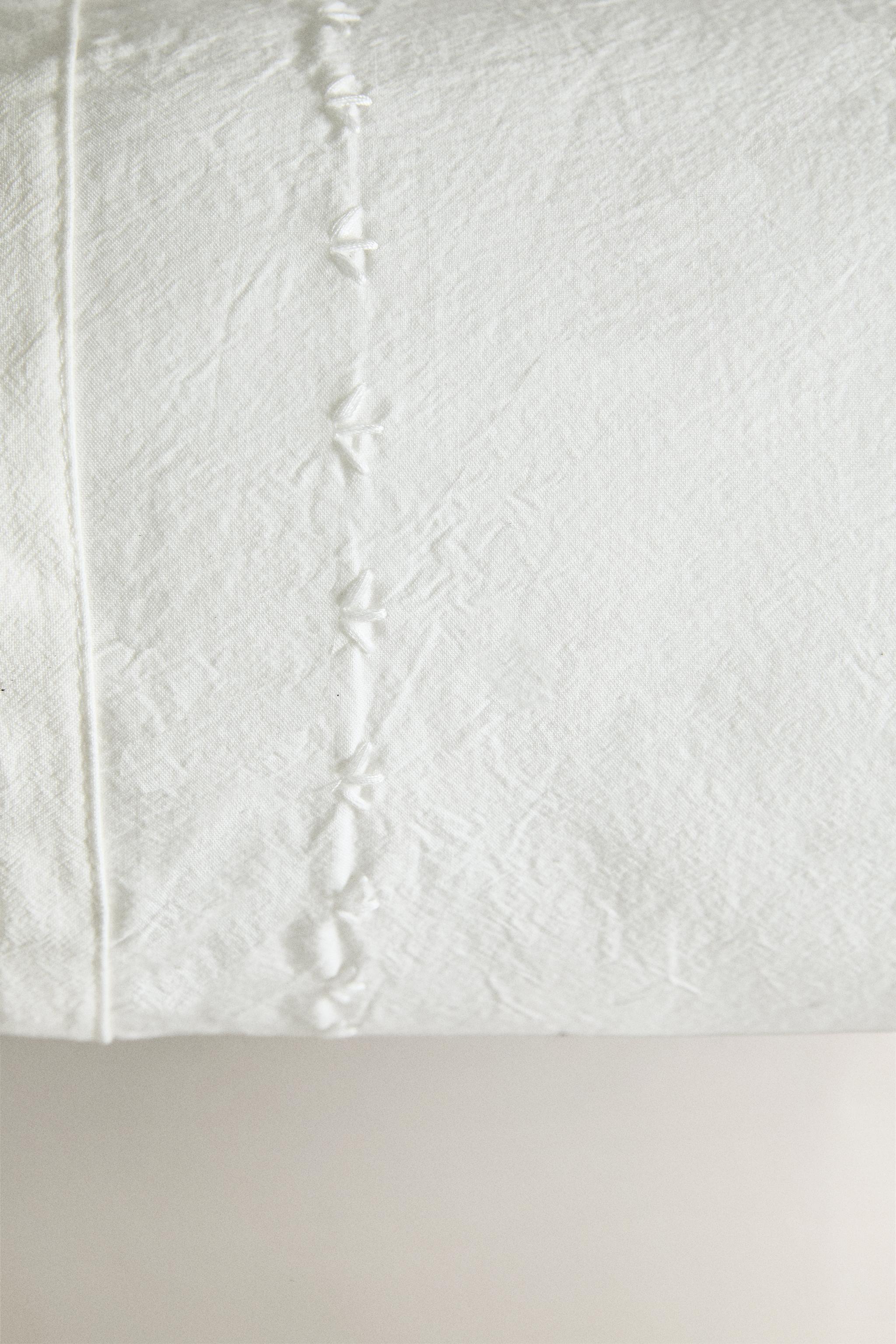 CHILDREN'S BOLSTER CUSHION WITH EMBROIDERED DESIGN