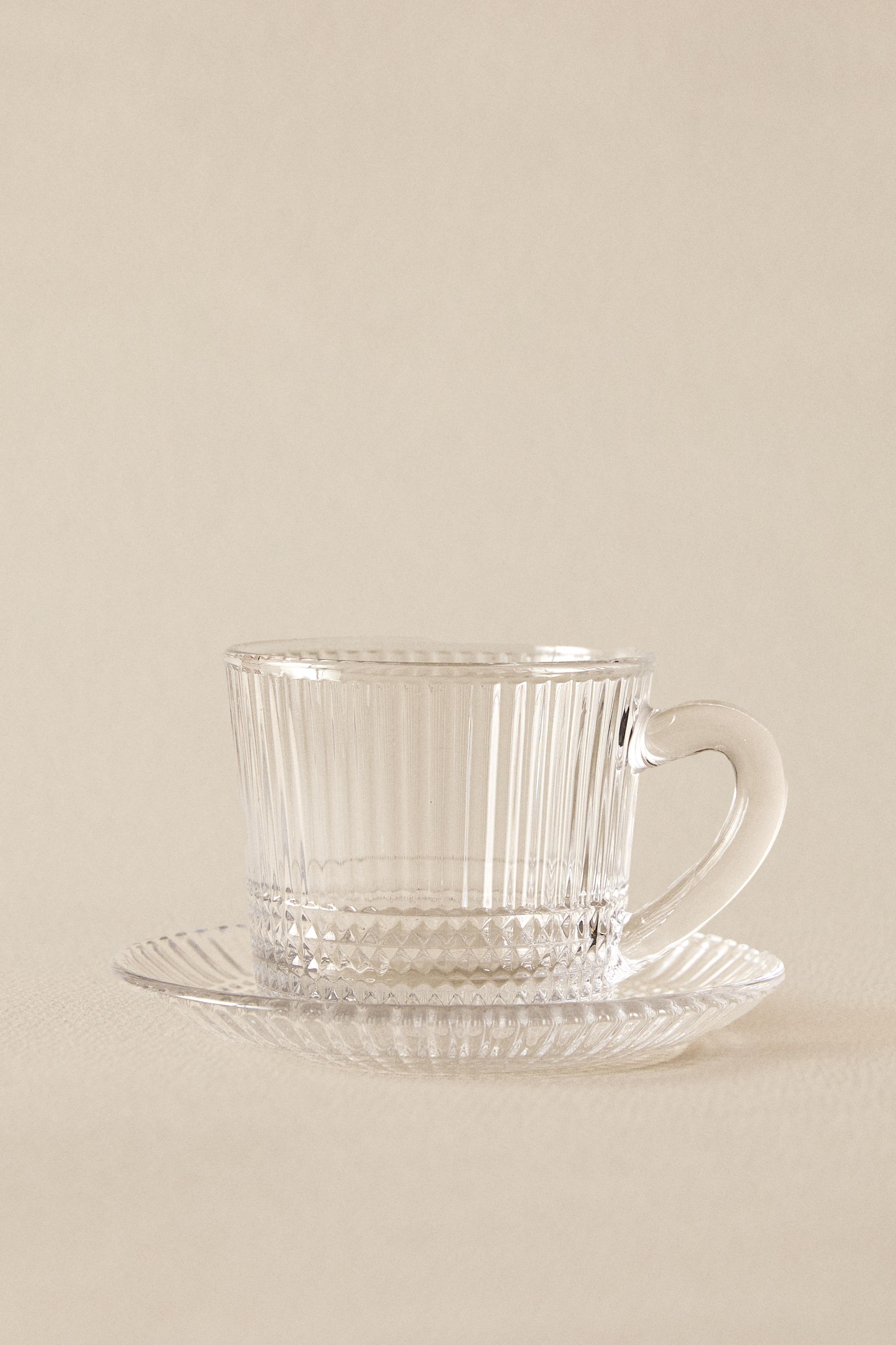 COFFEE CUP AND SAUCER WITH RAISED GEOMETRIC DESIGN