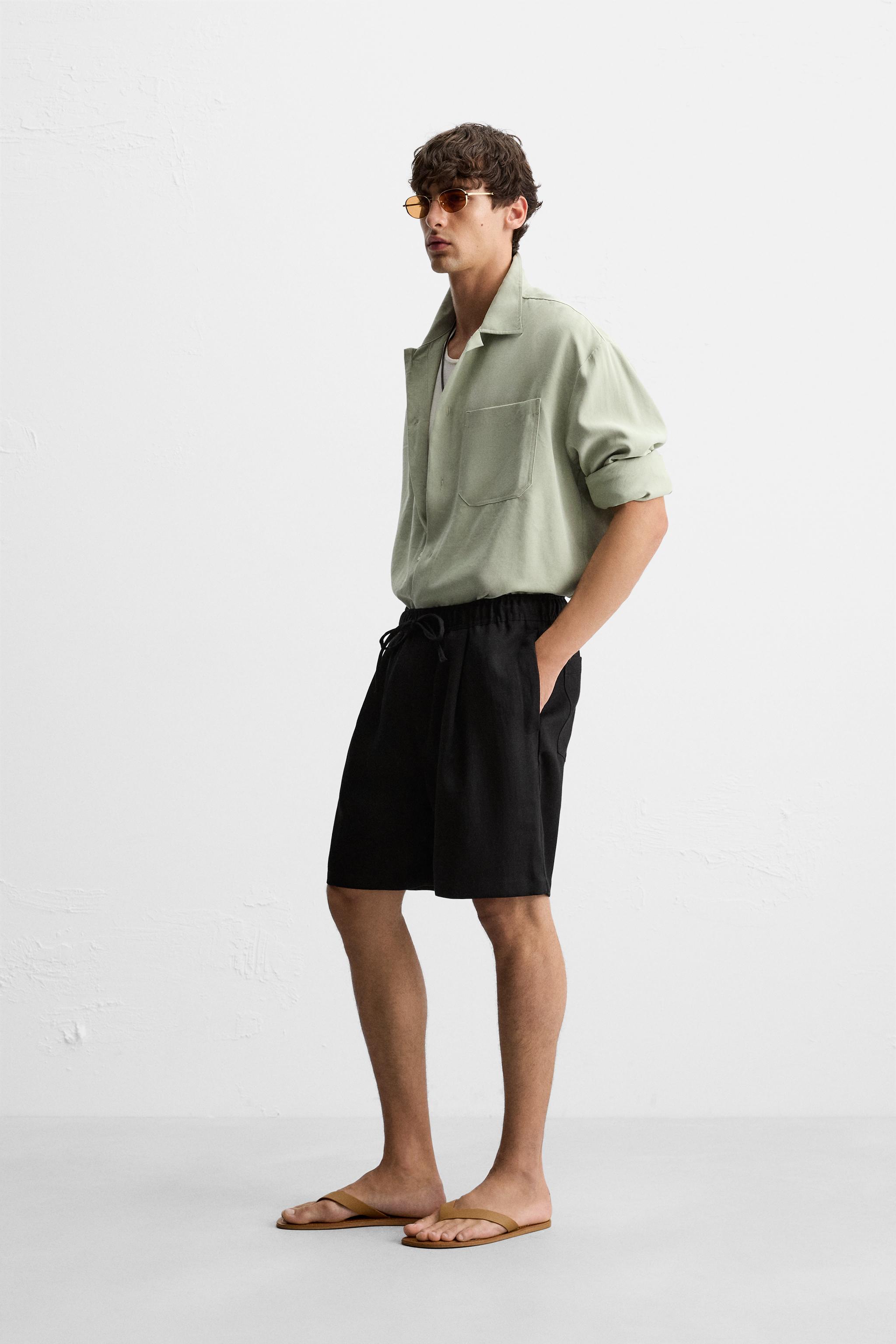 PLEATED FLOWY SHORTS