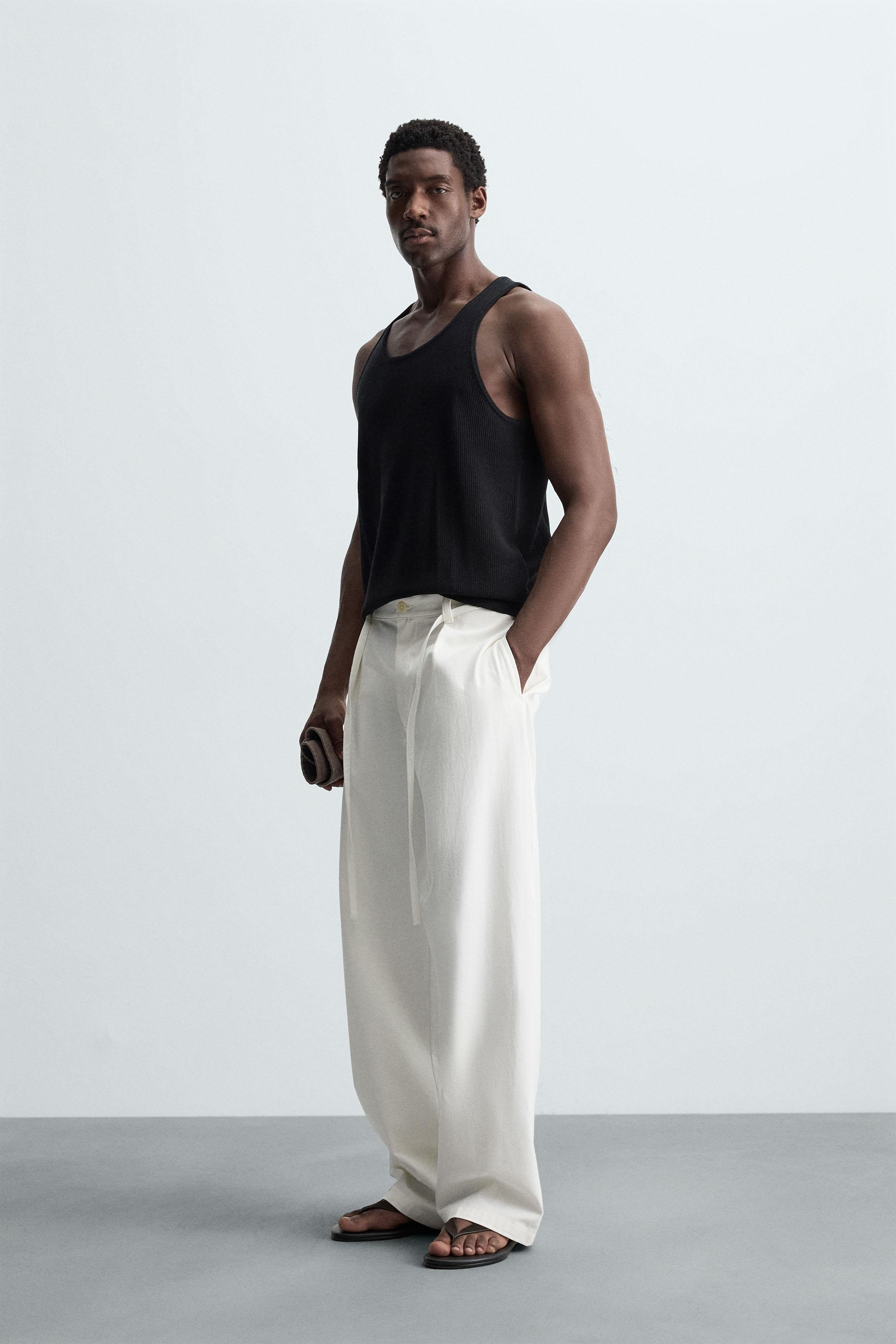RELAXED FIT PLEATED PANTS