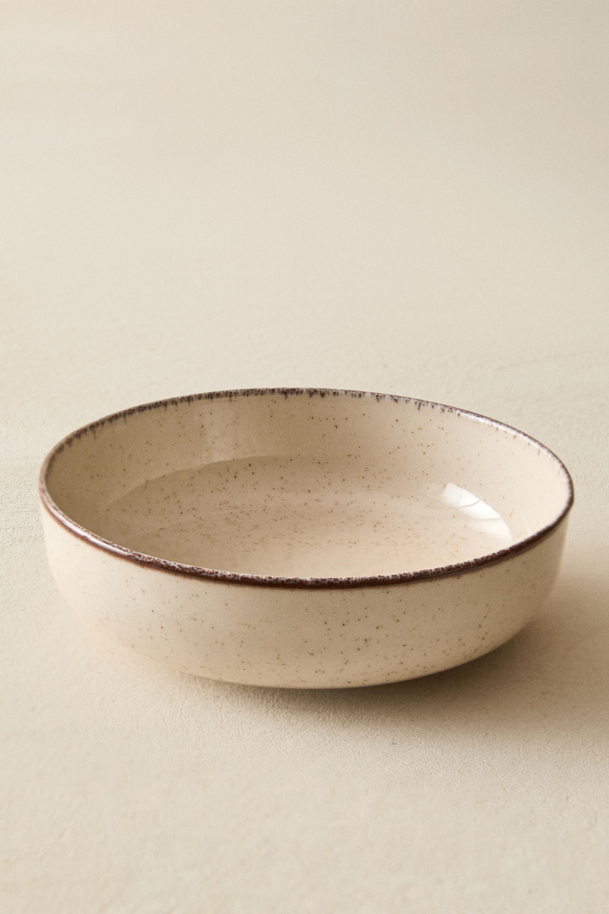 PORCELAIN BOWL WITH ANTIQUE FINISH RIM