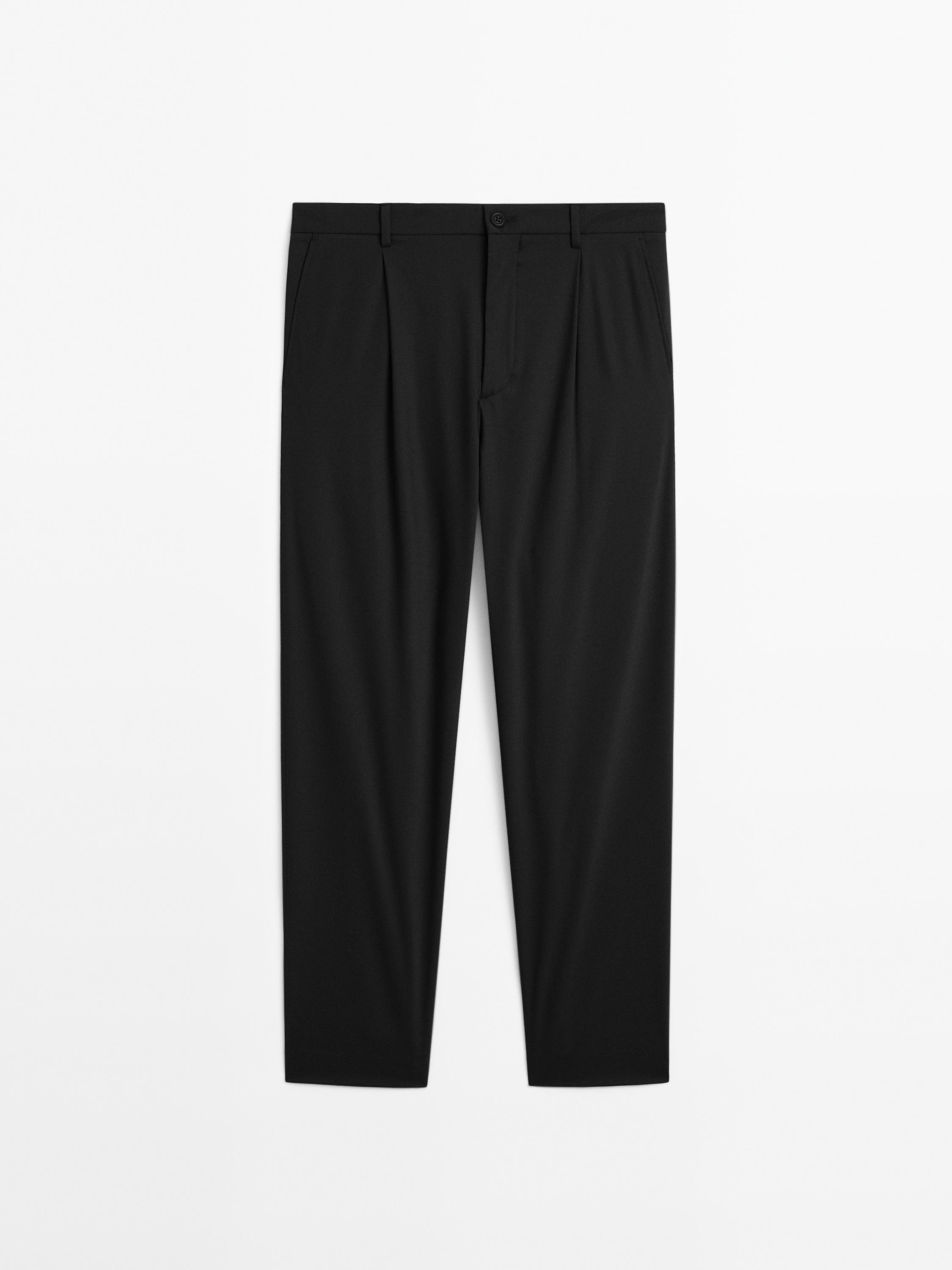 Relaxed fit trousers with darts