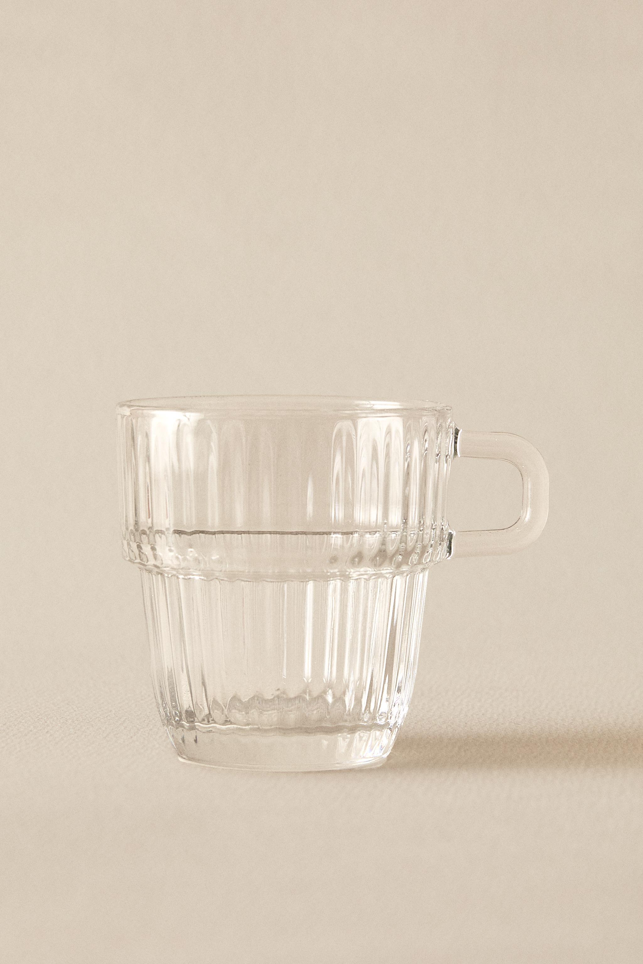 GLASS CUP WITH RAISED DESIGN