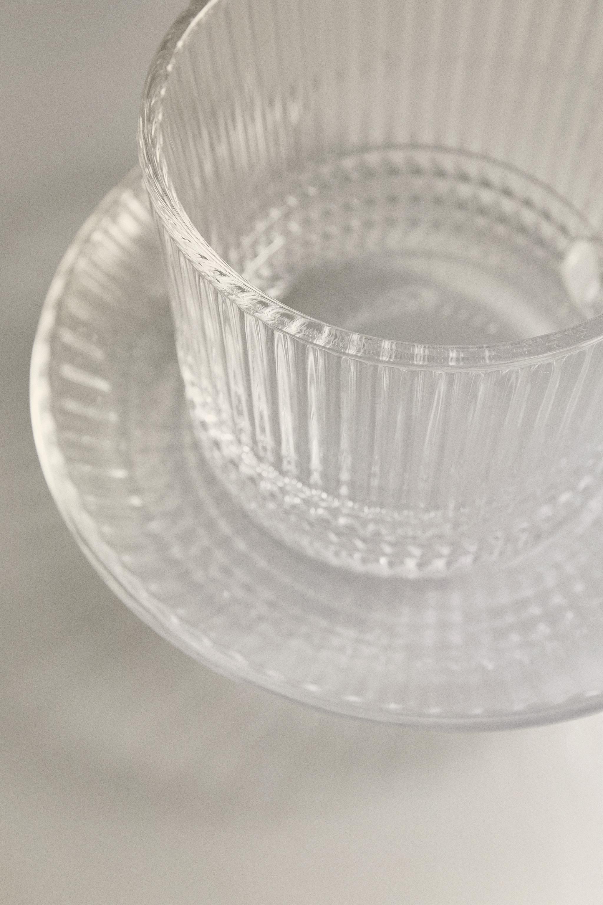 COFFEE CUP AND SAUCER WITH RAISED GEOMETRIC DESIGN