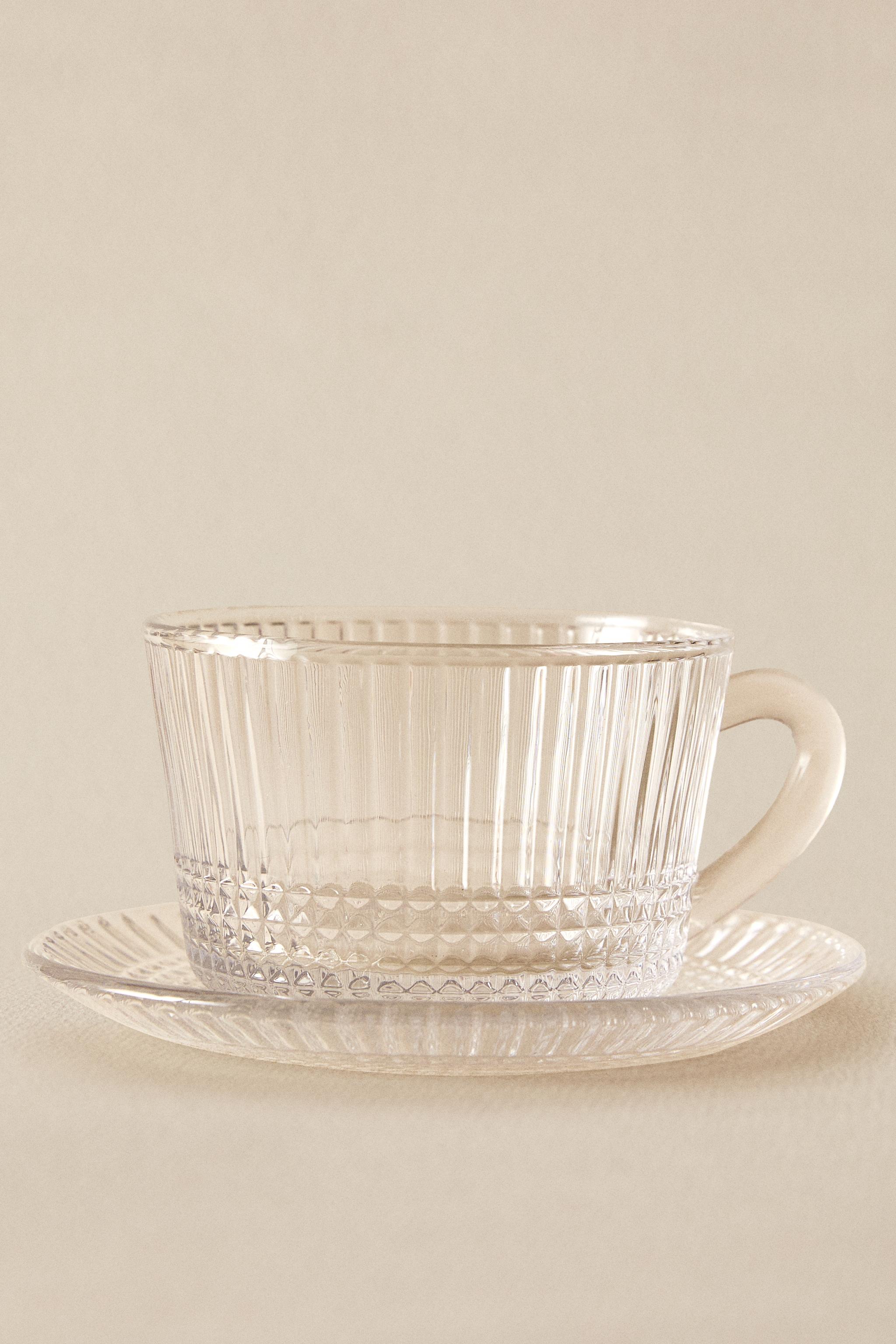 GLASS TEACUP WITH RAISED GEOMETRIC DESIGN