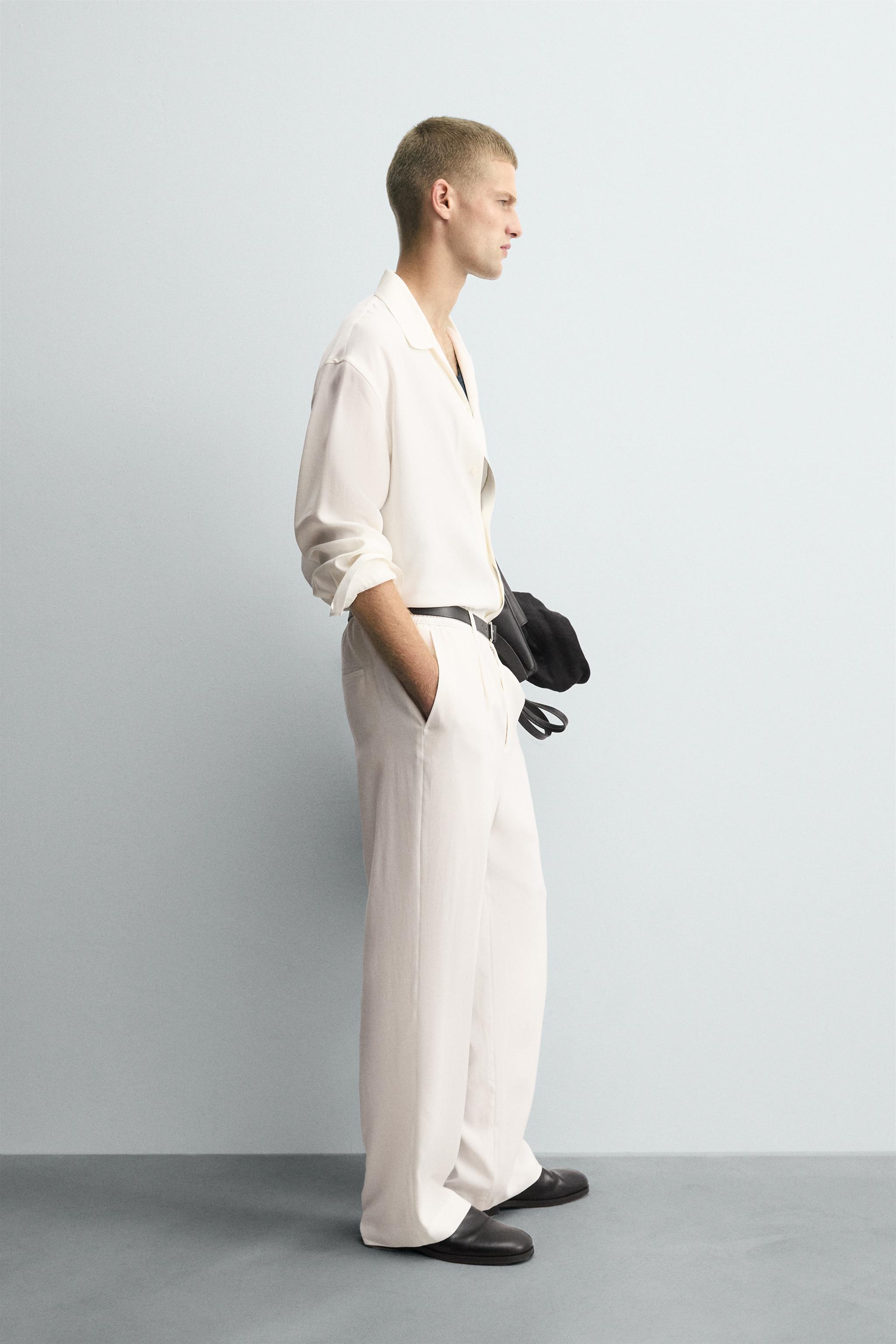 RELAXED FIT PLEATED PANTS