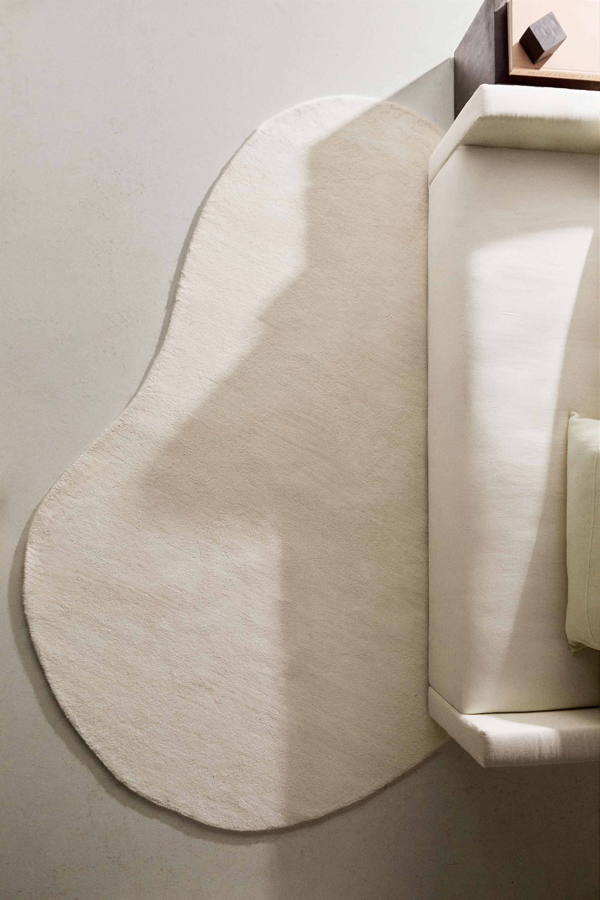 PLAIN IRREGULAR WOOL AREA RUG