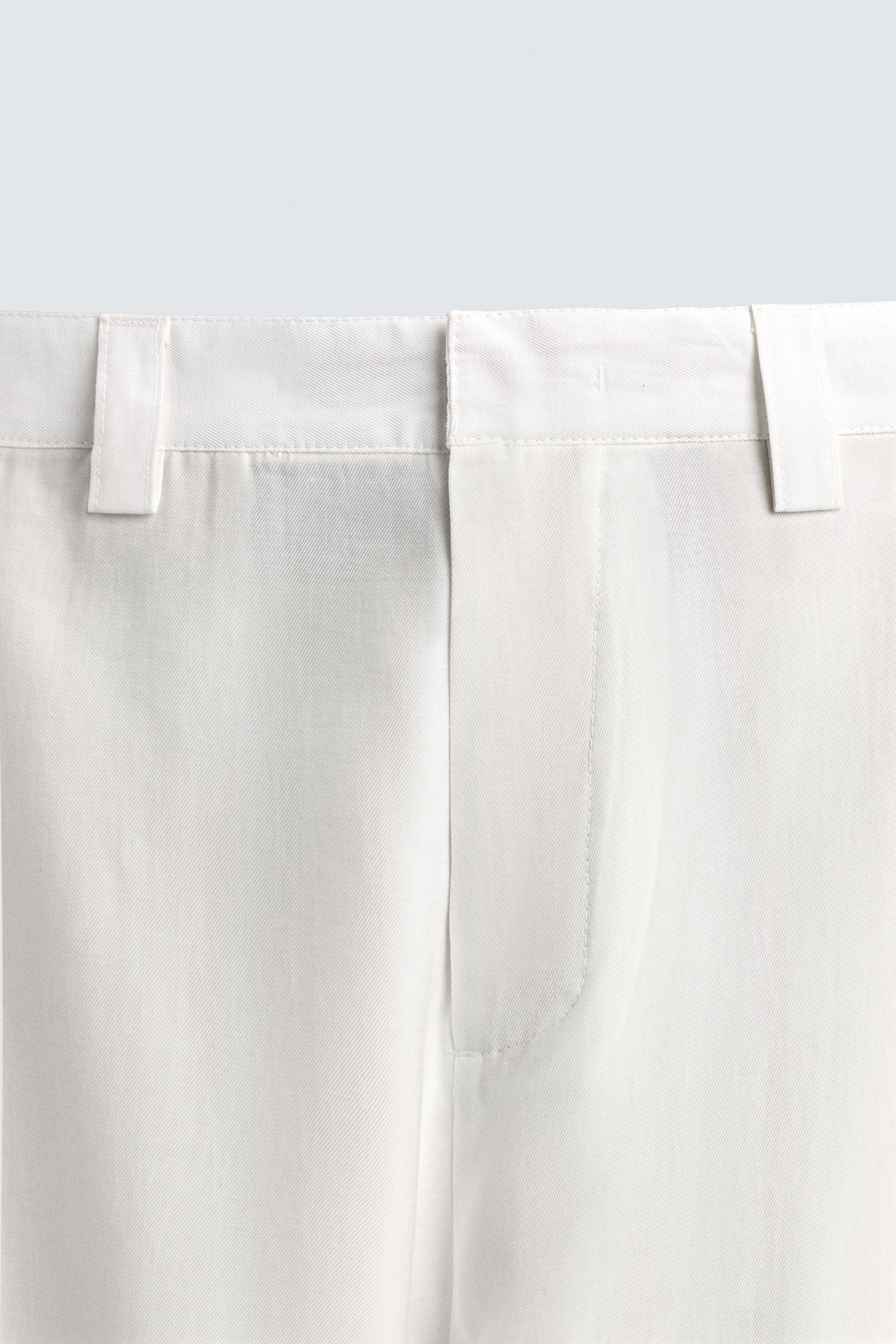 FLOWY PANTS WITH SIDE PLEATS