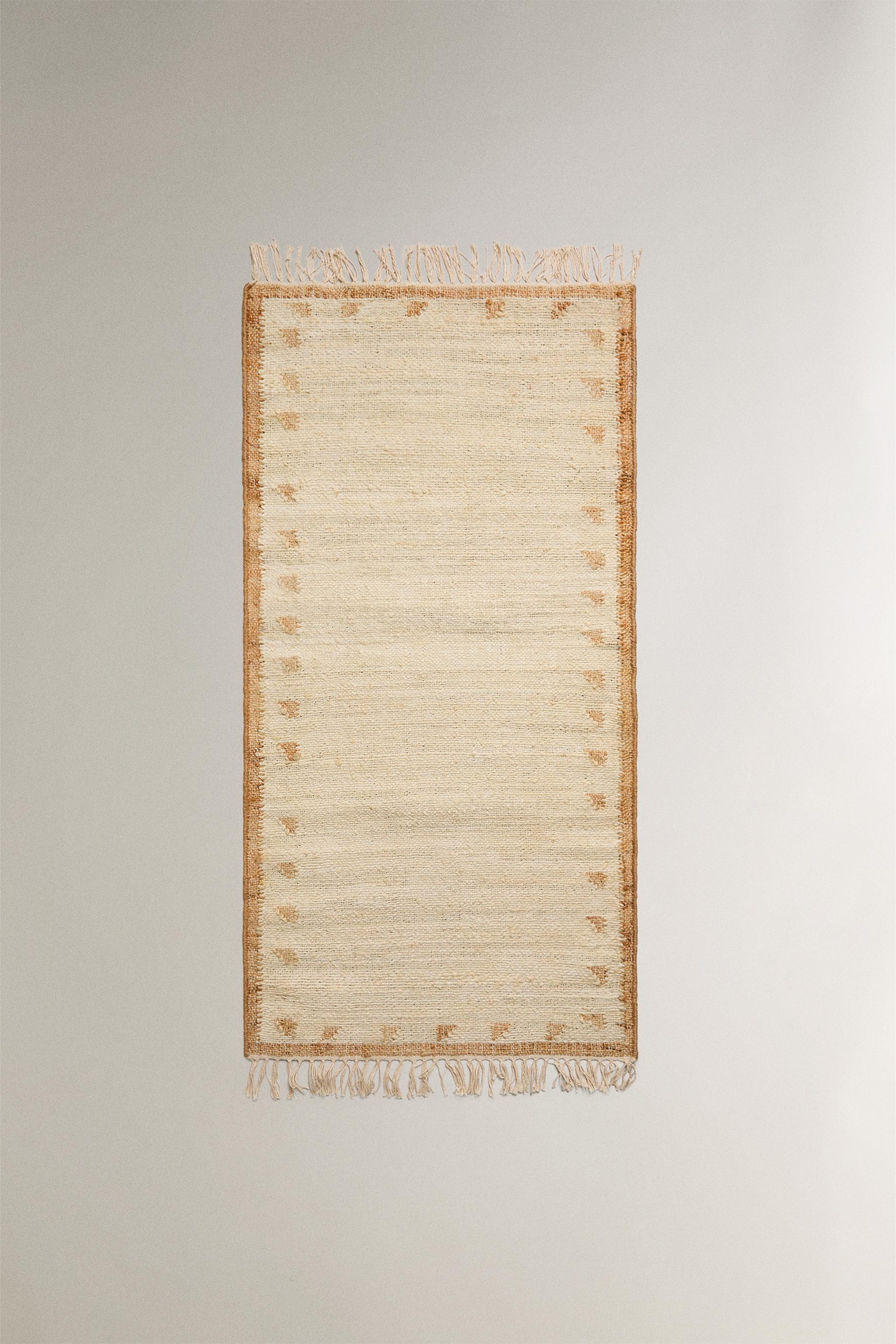 JUTE AND COTTON AREA RUG WITH FRINGING
