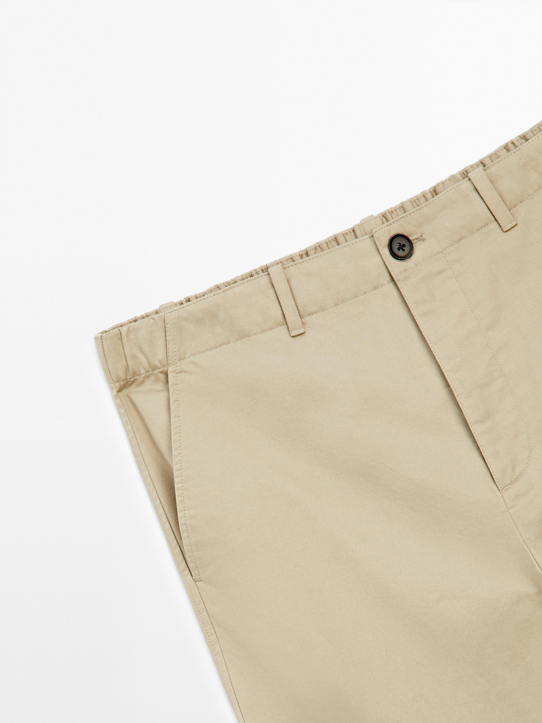 Trousers with patch pocket