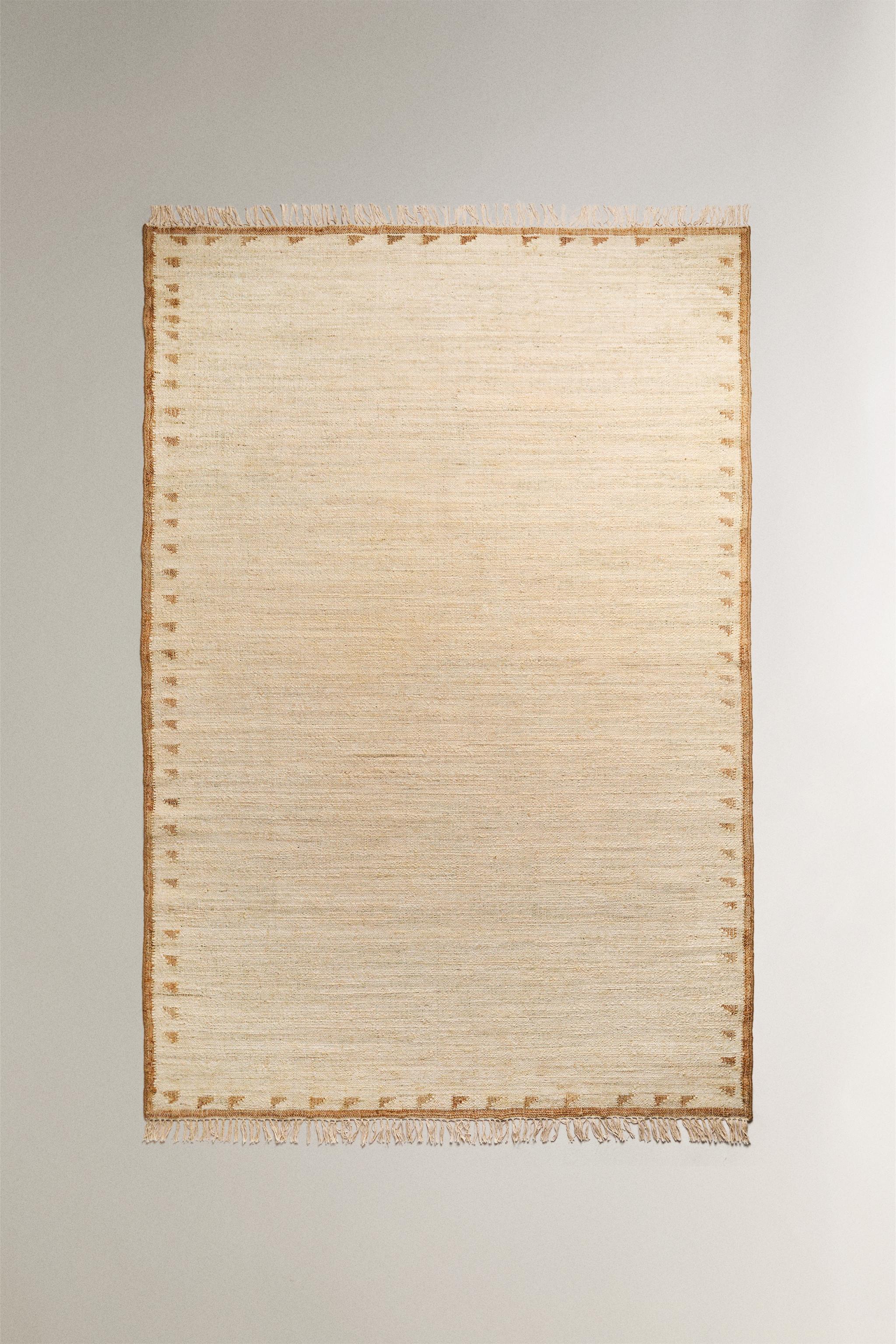 JUTE AND COTTON AREA RUG WITH FRINGING