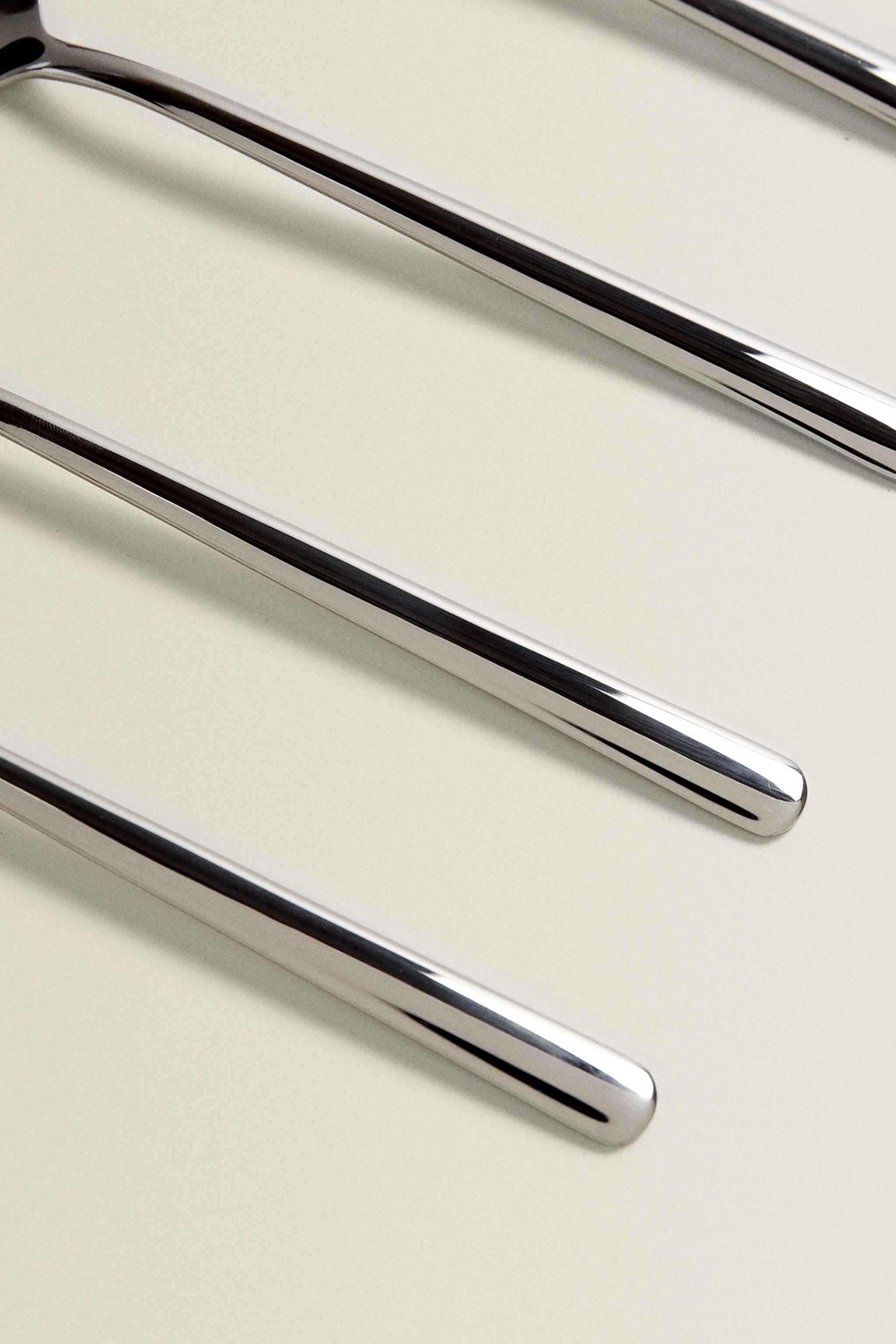 SET OF SHINY STEEL SPOONS (SET OF 4)