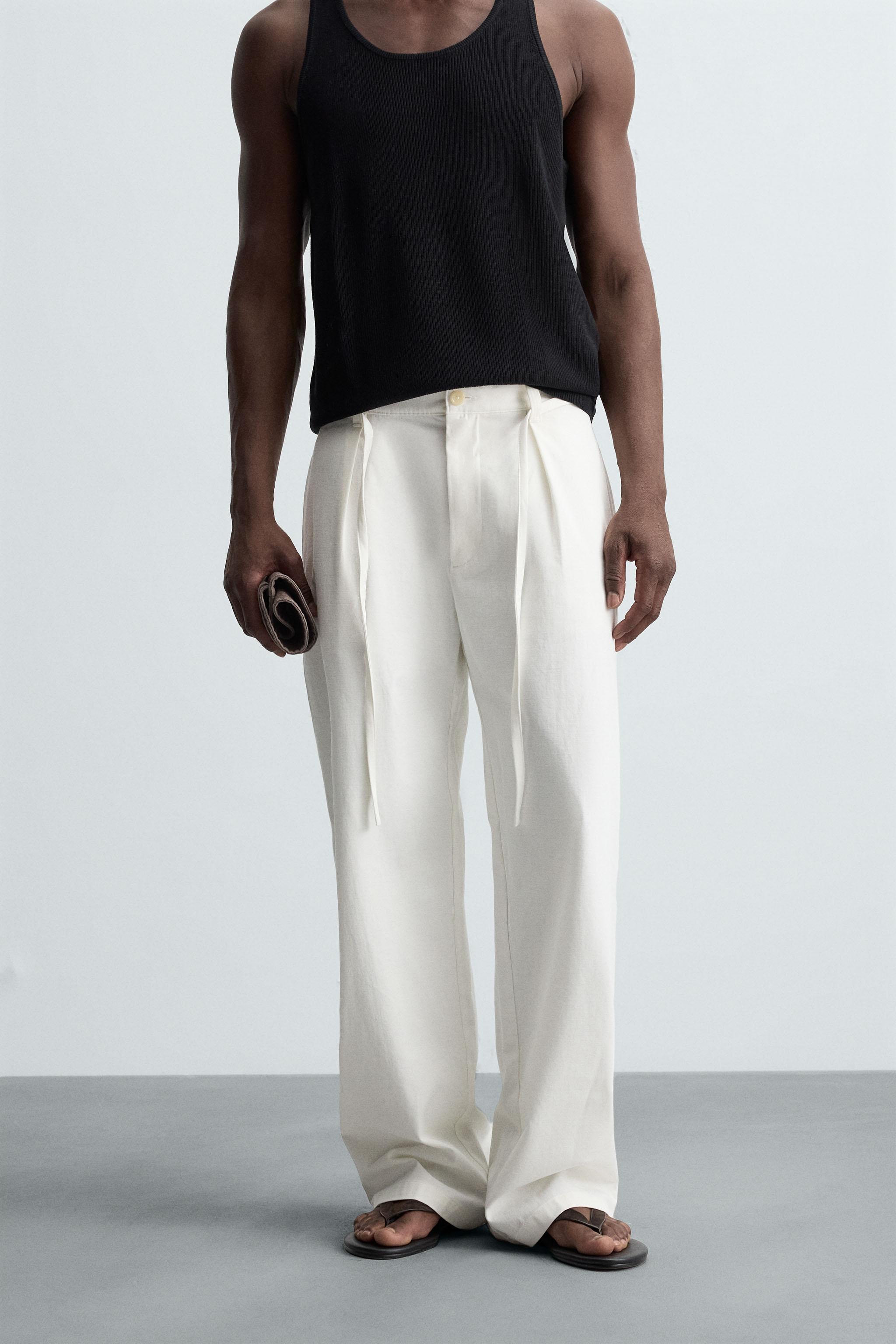 RELAXED FIT PLEATED PANTS