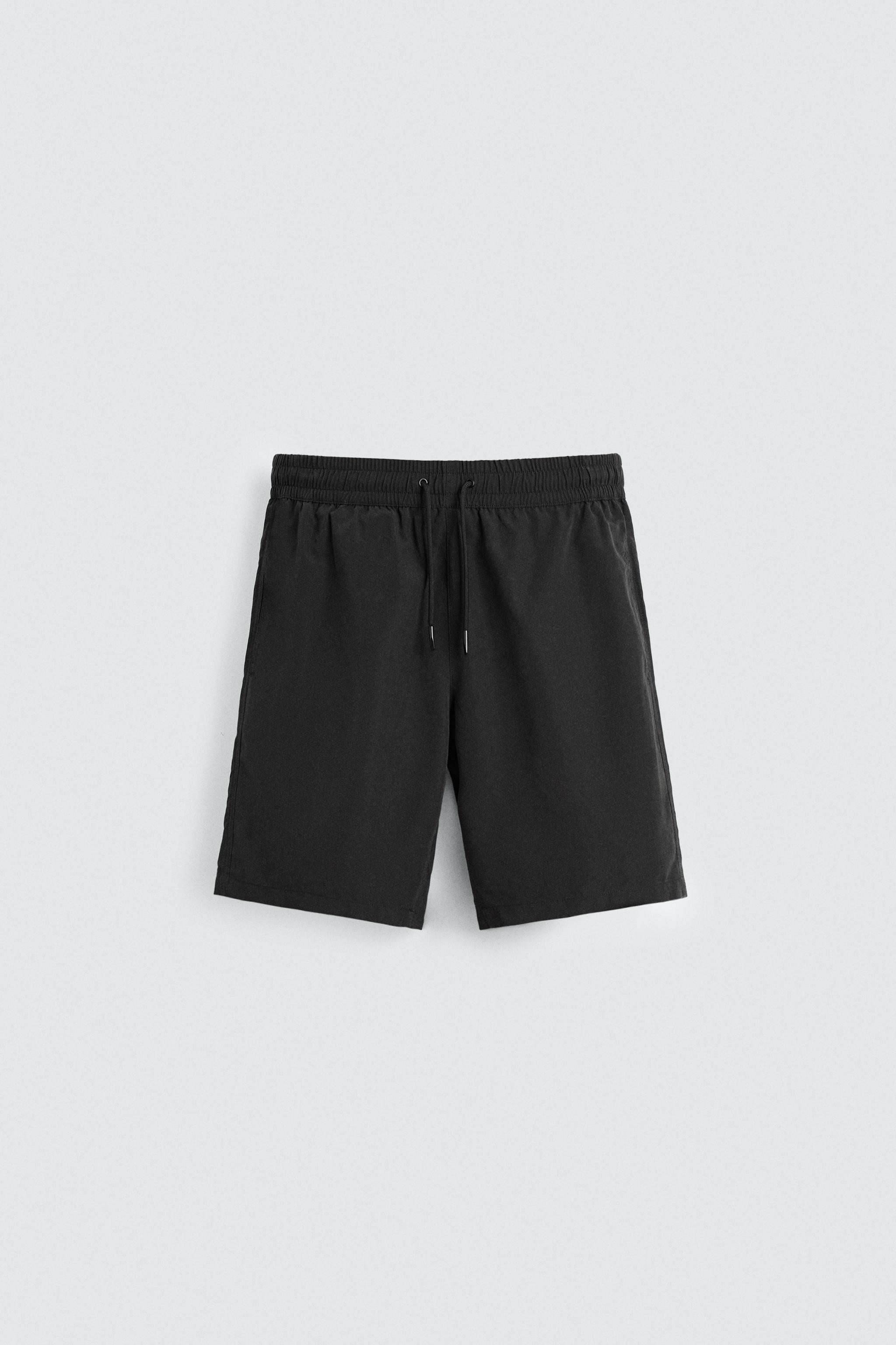 BASIC LONG SWIM TRUNKS