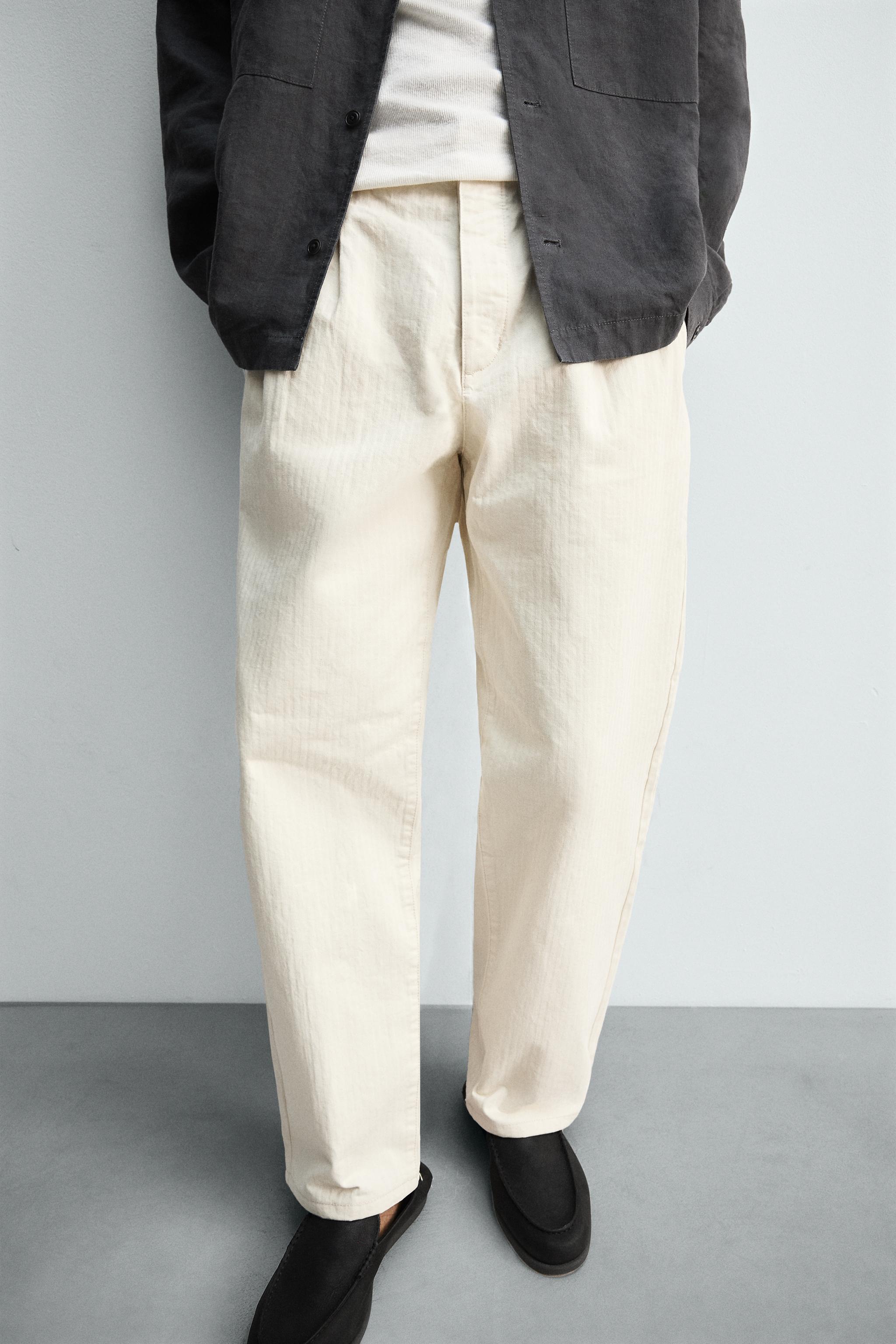 PLEATED HERRINGBONE PANTS