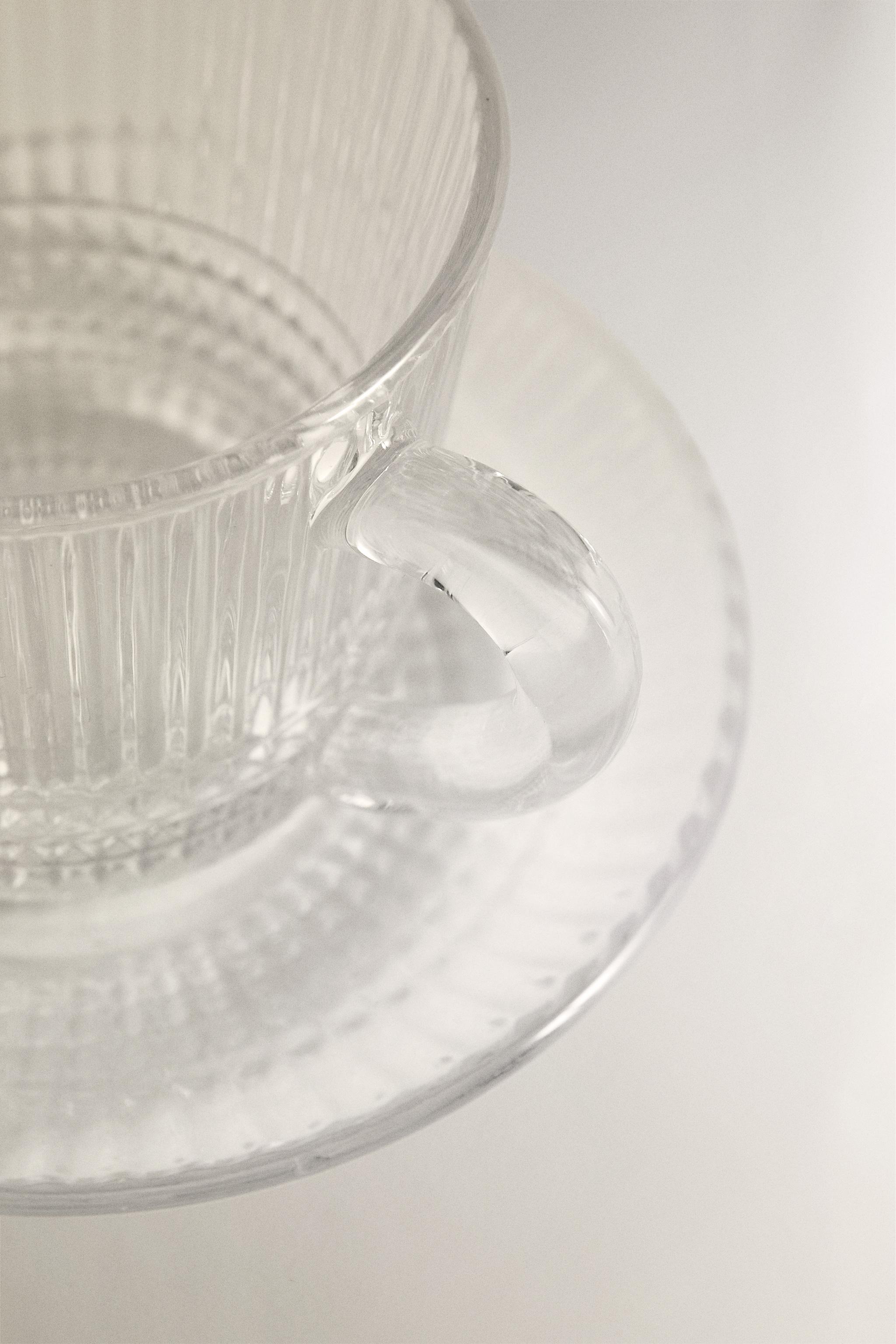 COFFEE CUP AND SAUCER WITH RAISED GEOMETRIC DESIGN