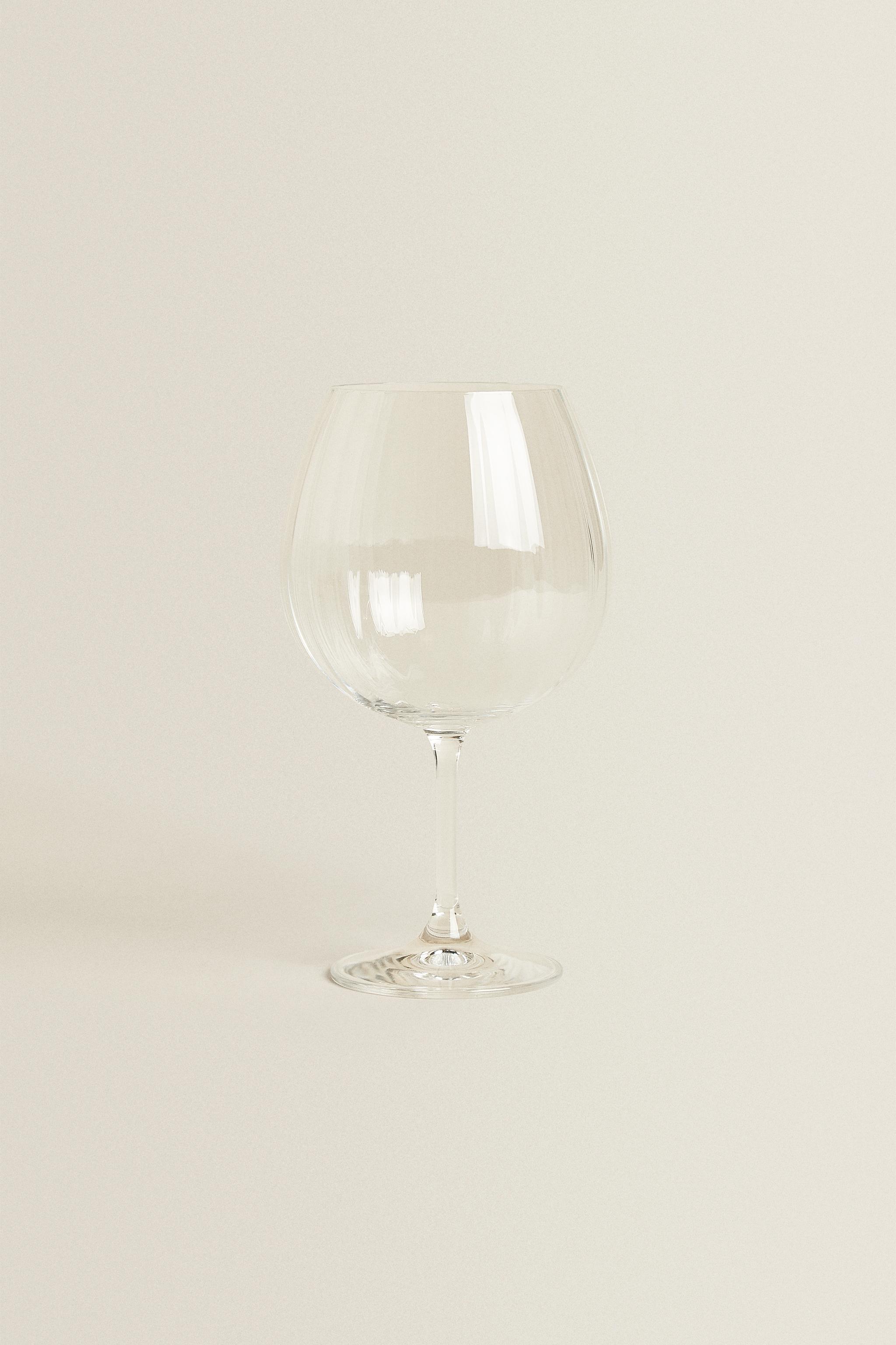 CRYSTALLINE GLASS WITH A RAISED DESIGN