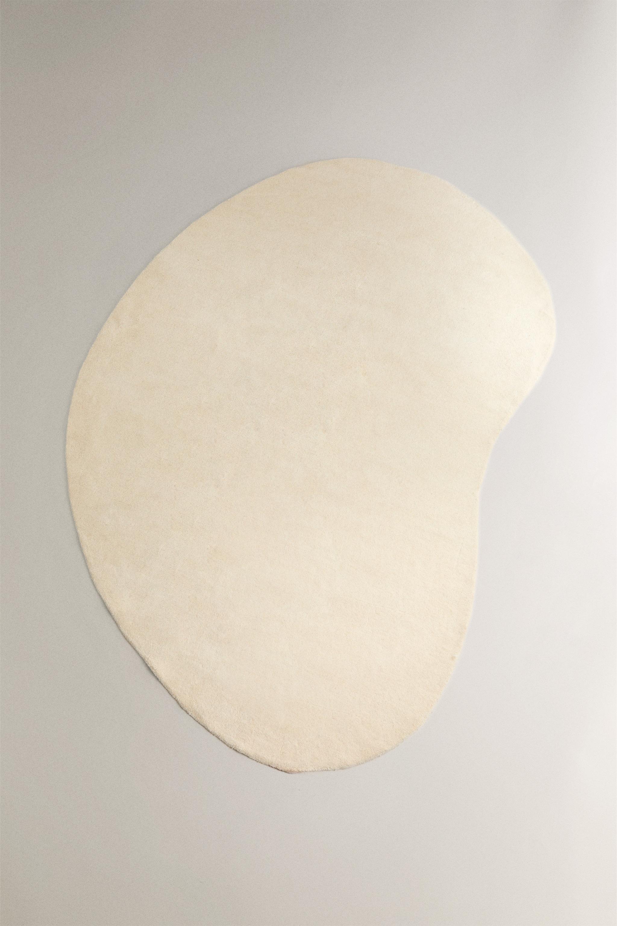 PLAIN IRREGULAR WOOL AREA RUG