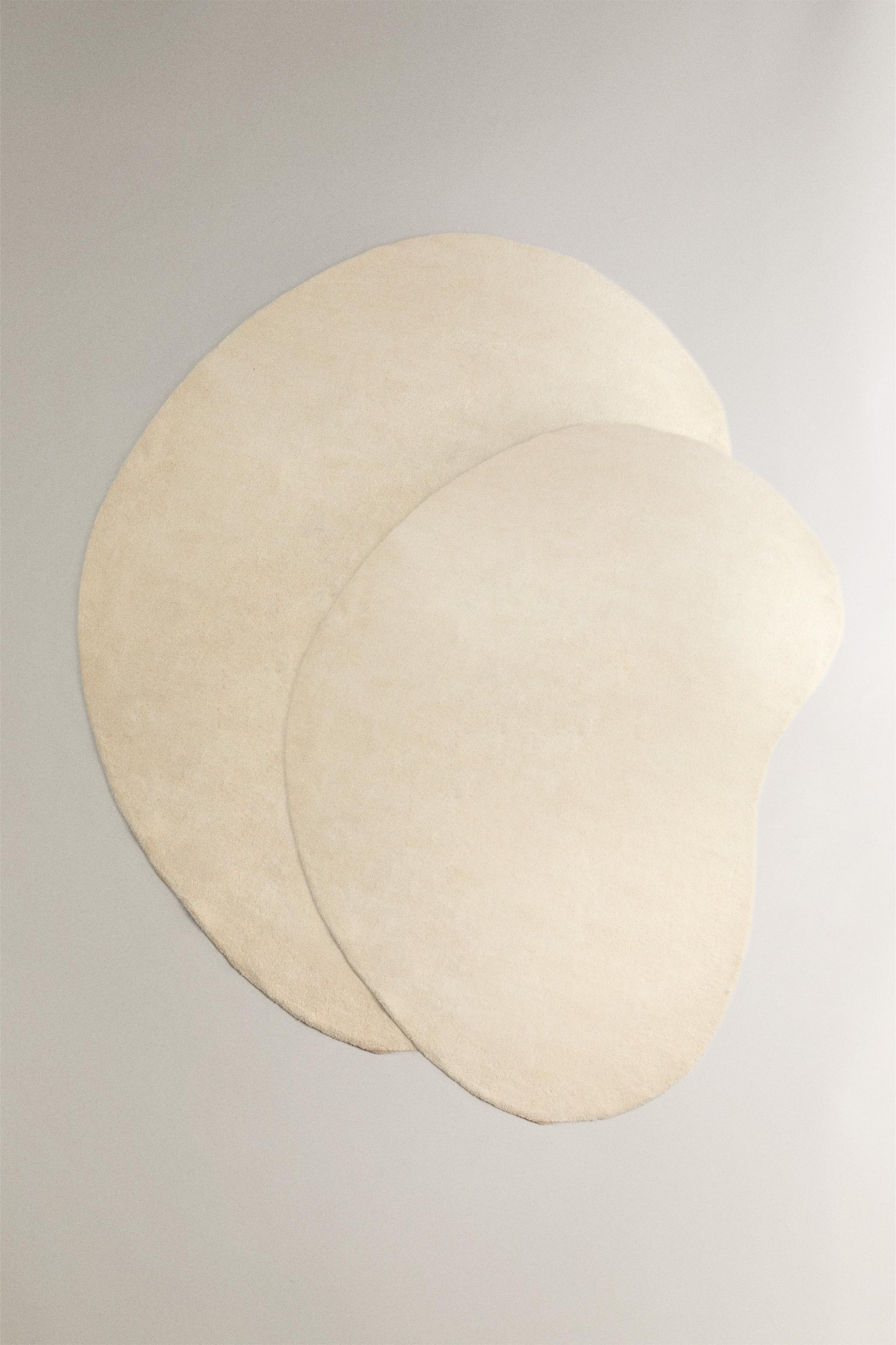 PLAIN IRREGULAR WOOL AREA RUG