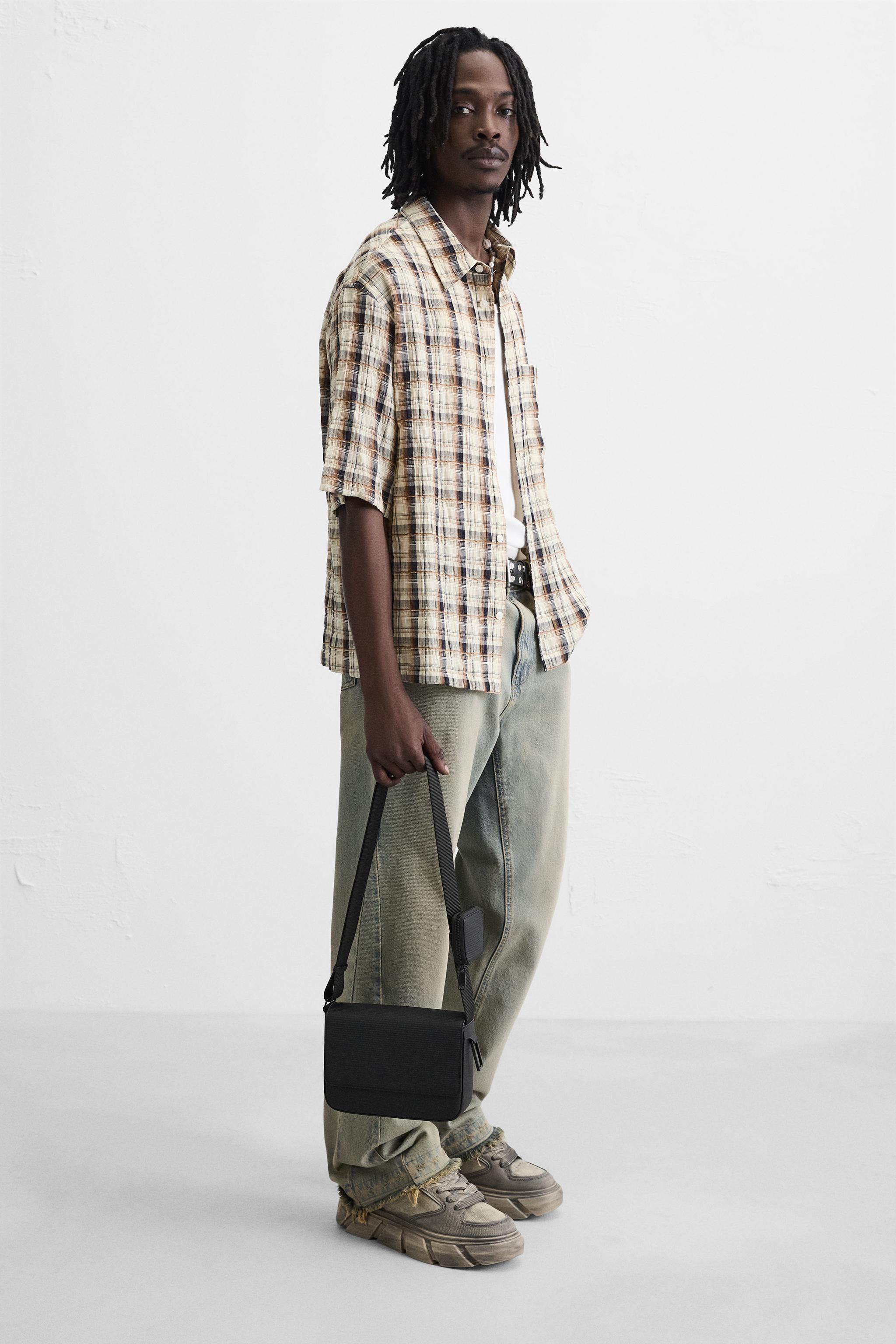 TEXTURED RUBBERIZED CROSSBODY BAG